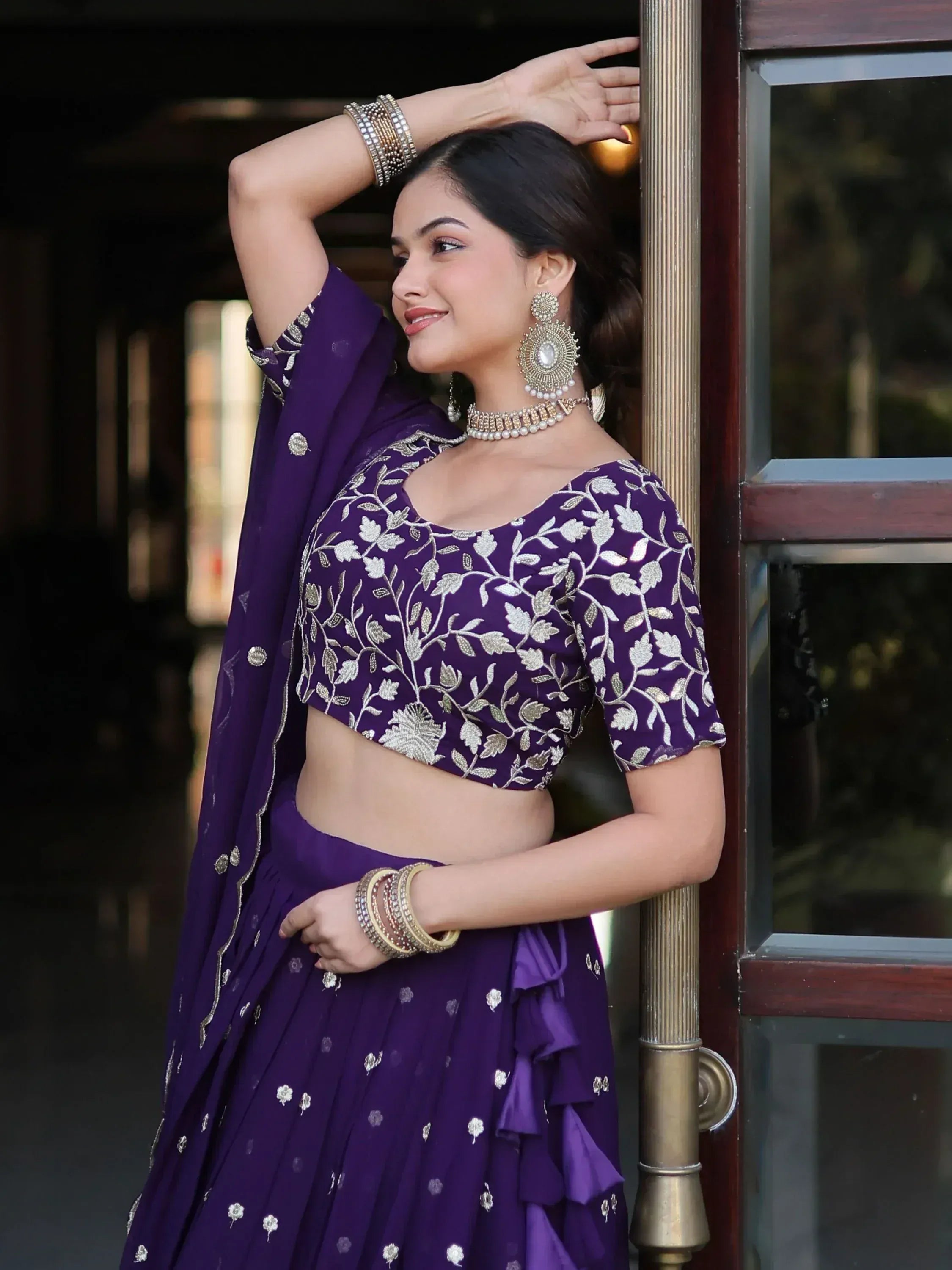 Purple embroidered lehenga choli with floral design, perfect for Indian ethnic wear and festive occasions.