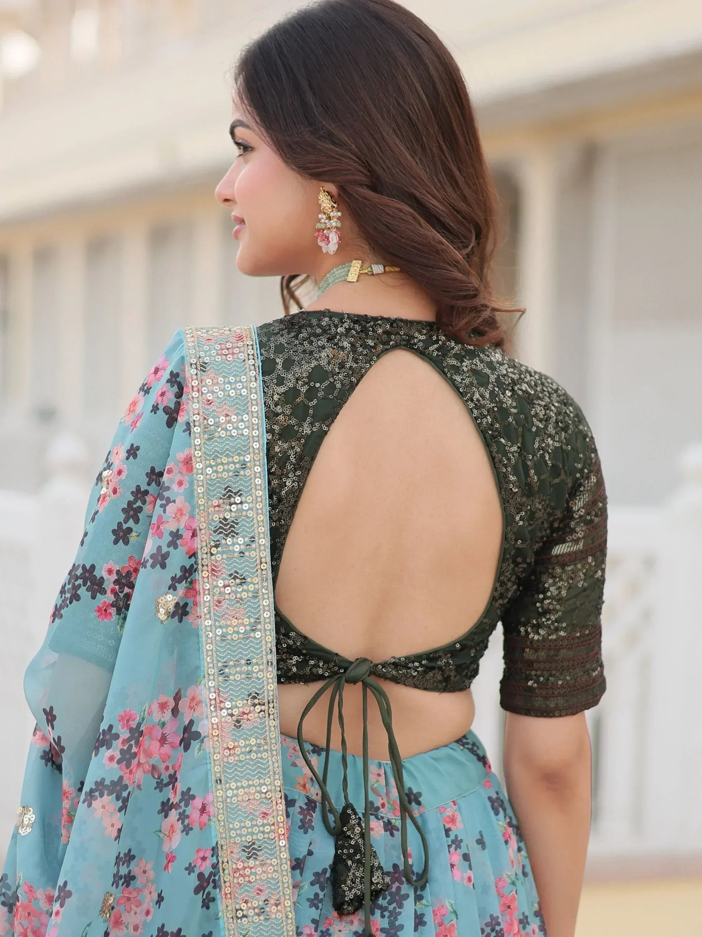 Woman in floral lehenga choli with sequin backless blouse and dupatta, Indian ethnic wear