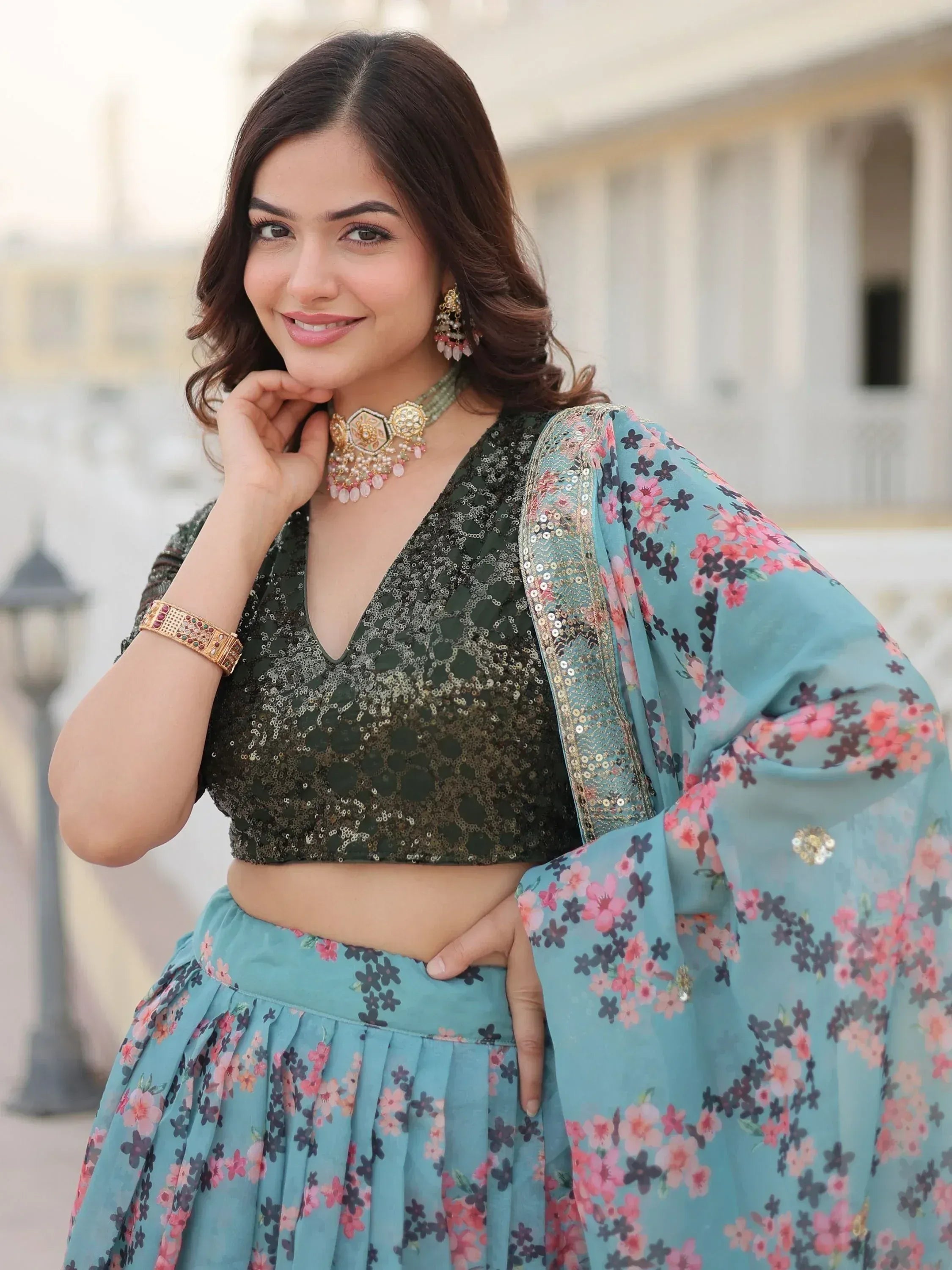 Woman in floral lehenga choli with sequin blouse, perfect for Indian ethnic wear occasions