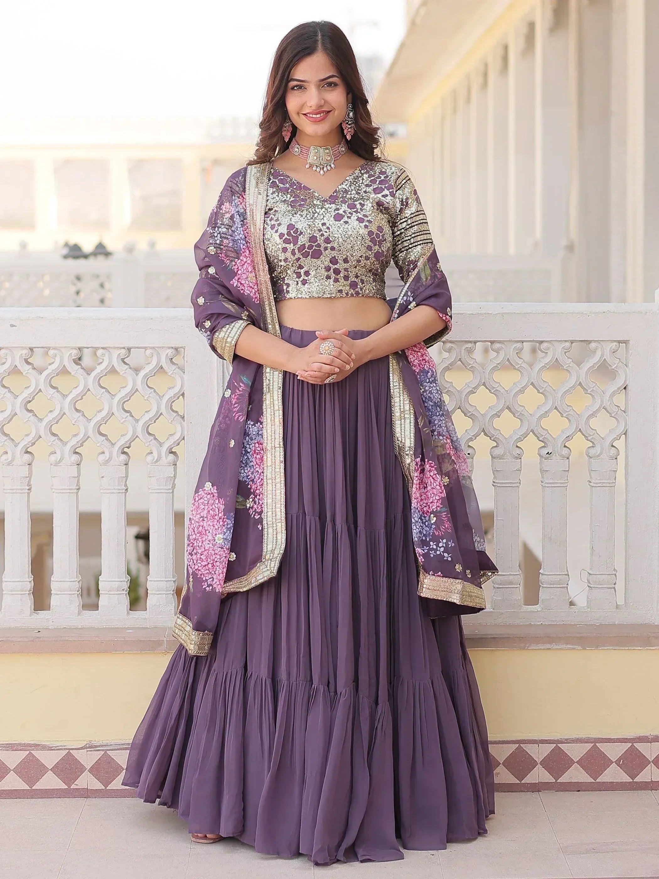 Purple floral lehenga choli with embroidered crop top and layered skirt, perfect for Indian ethnic wear occasions