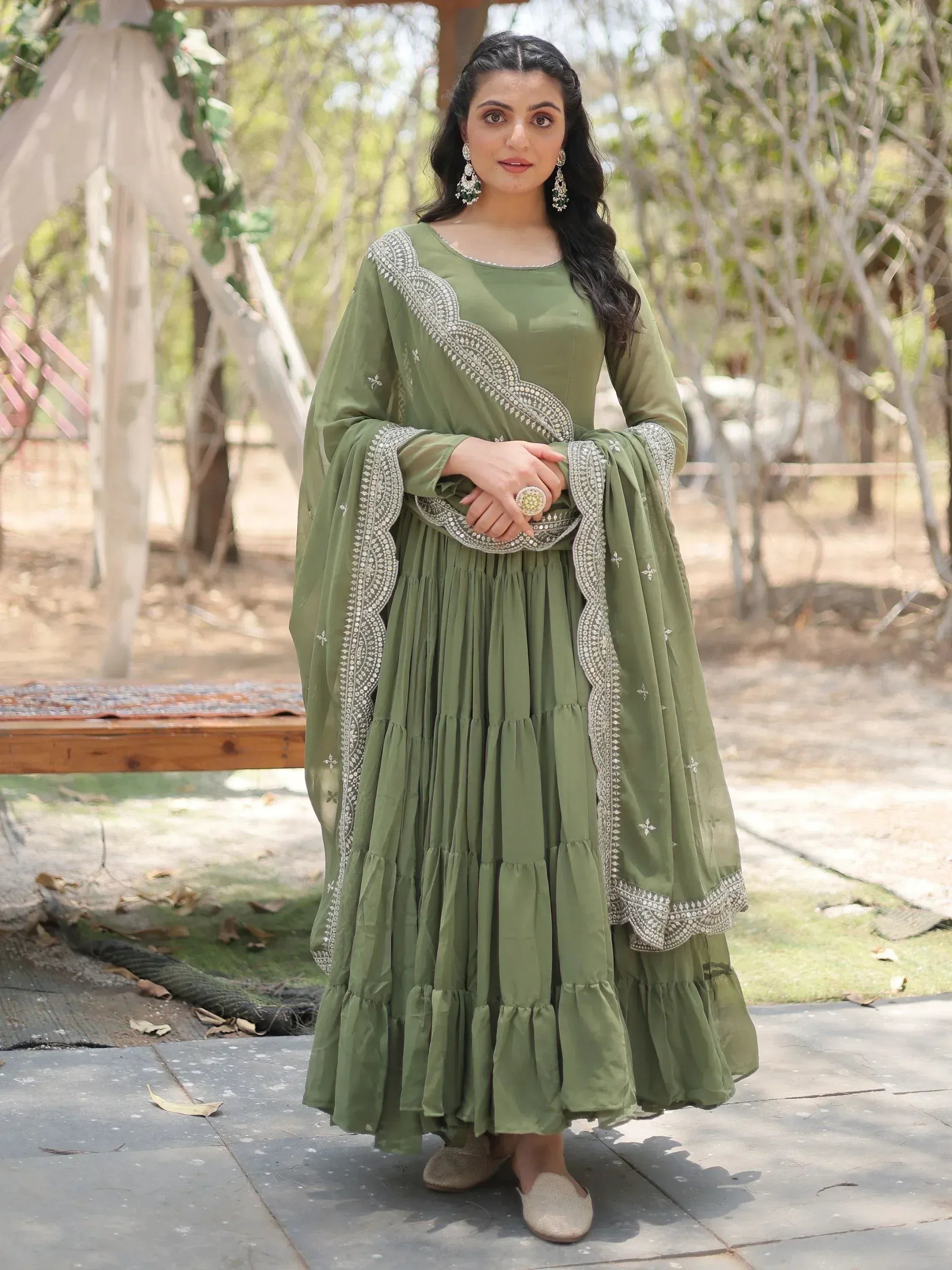 Olive green ethnic anarkali suit with silver embroidery, perfect for Indian occasions and festive wear.