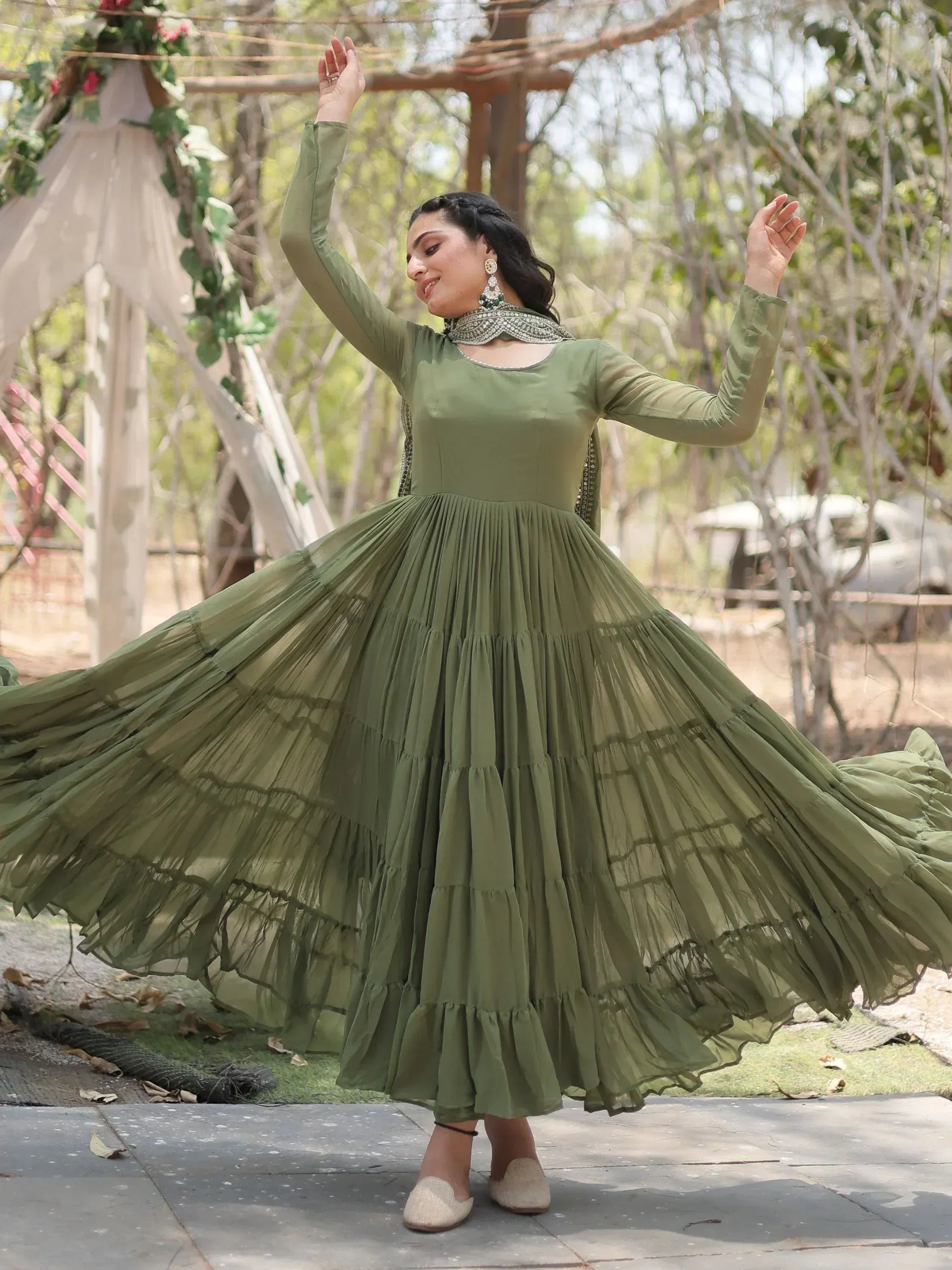 Olive green ethnic gown with layered pleated skirt, perfect for Indian occasions and festive wear.