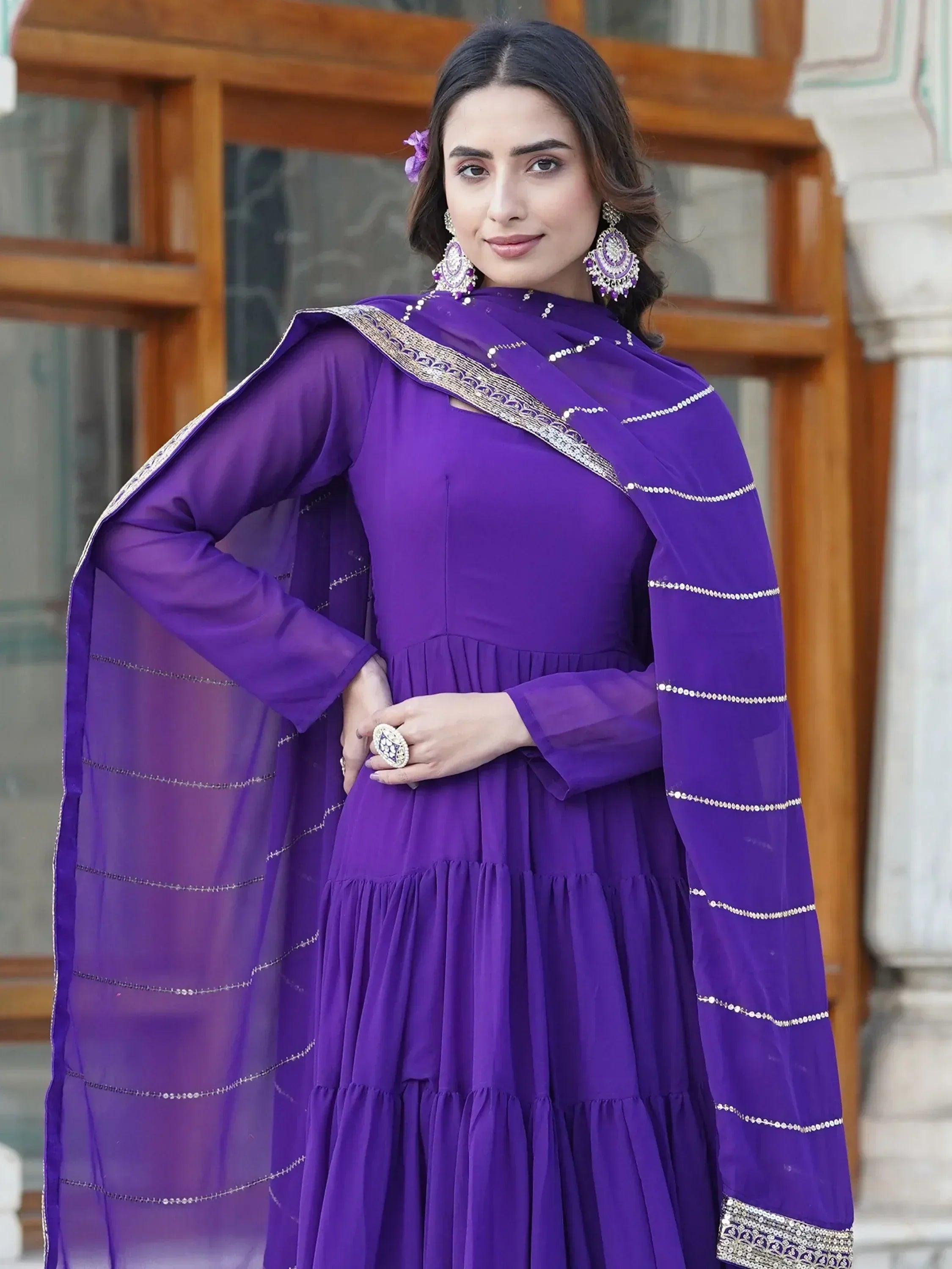 Purple ethnic anarkali gown with gold embroidery and sheer dupatta, perfect for Indian occasions