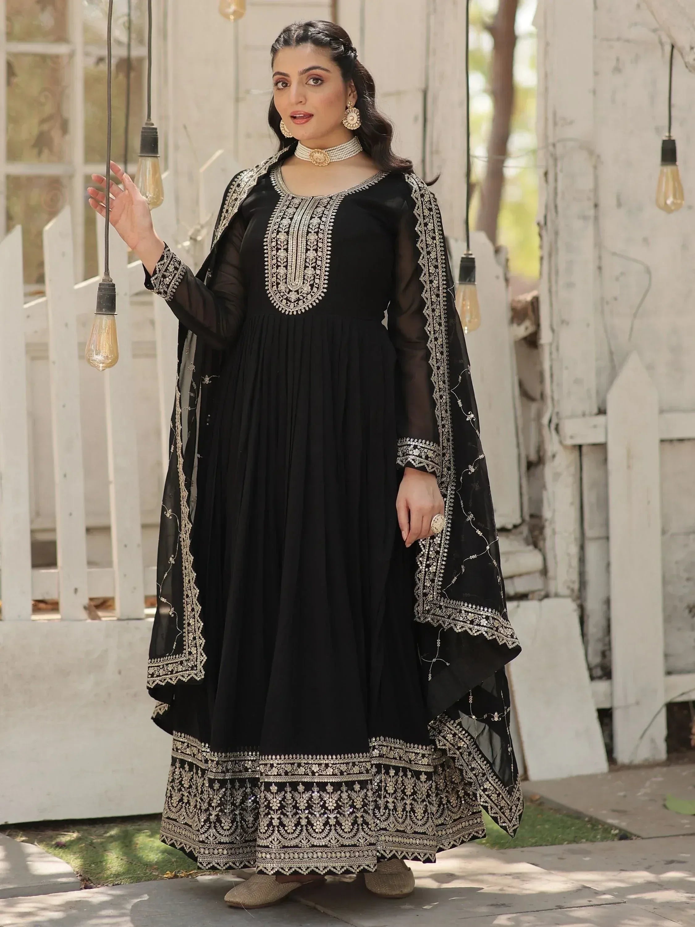 Black embroidered anarkali suit with gold detailing, perfect for Indian ethnic wear occasions.