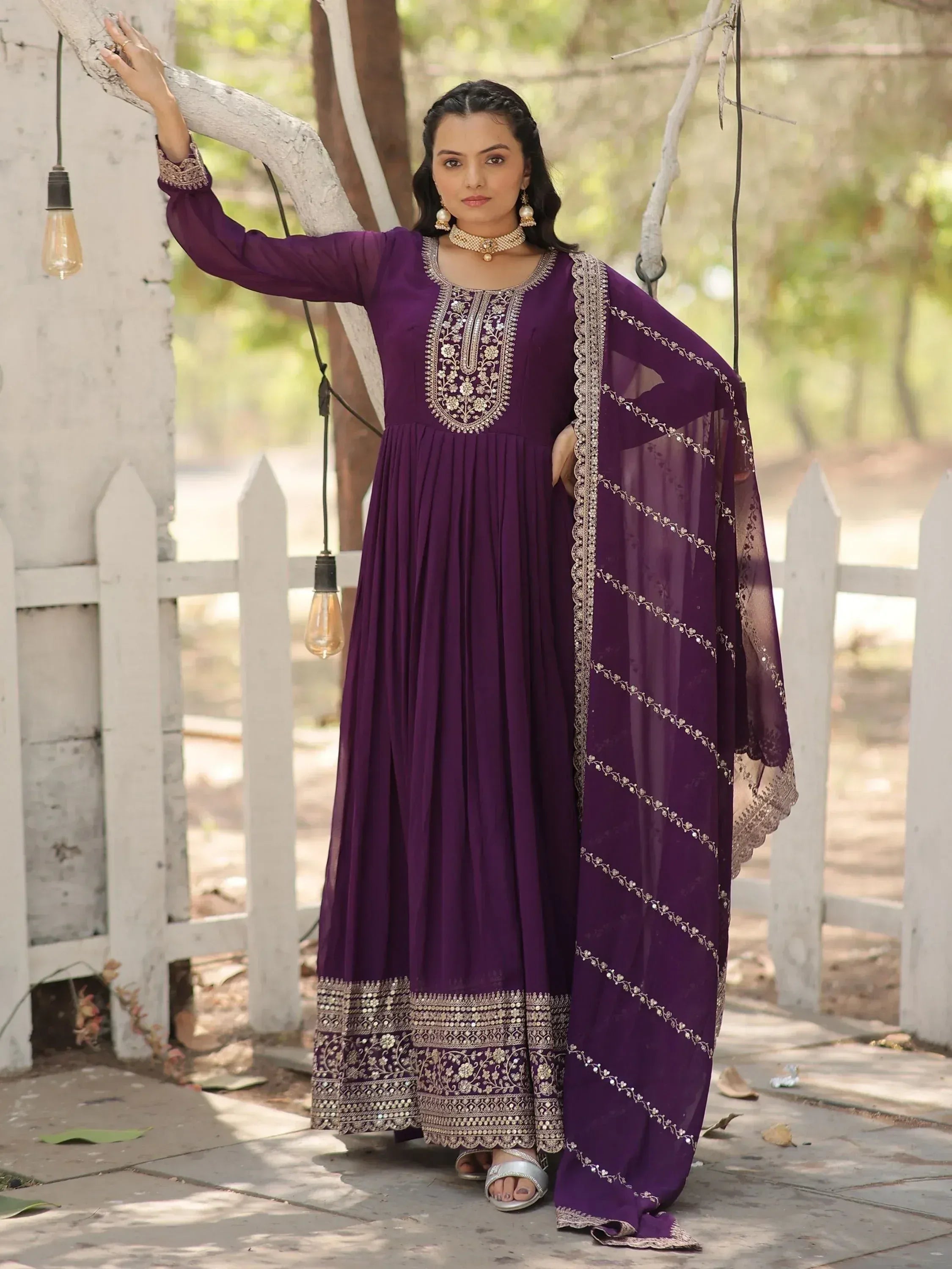 Purple embroidered ethnic gown with matching dupatta, perfect for Indian occasions and festive wear.