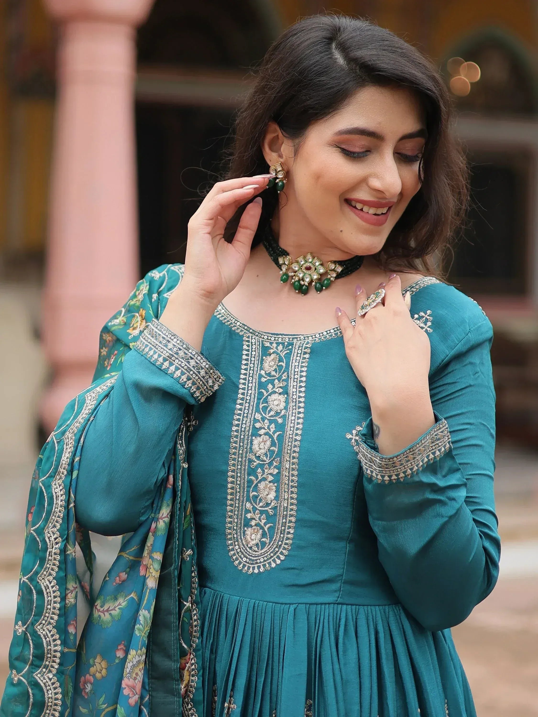 Teal embroidered ethnic gown with floral dupatta, perfect for Indian occasions and festive wear.