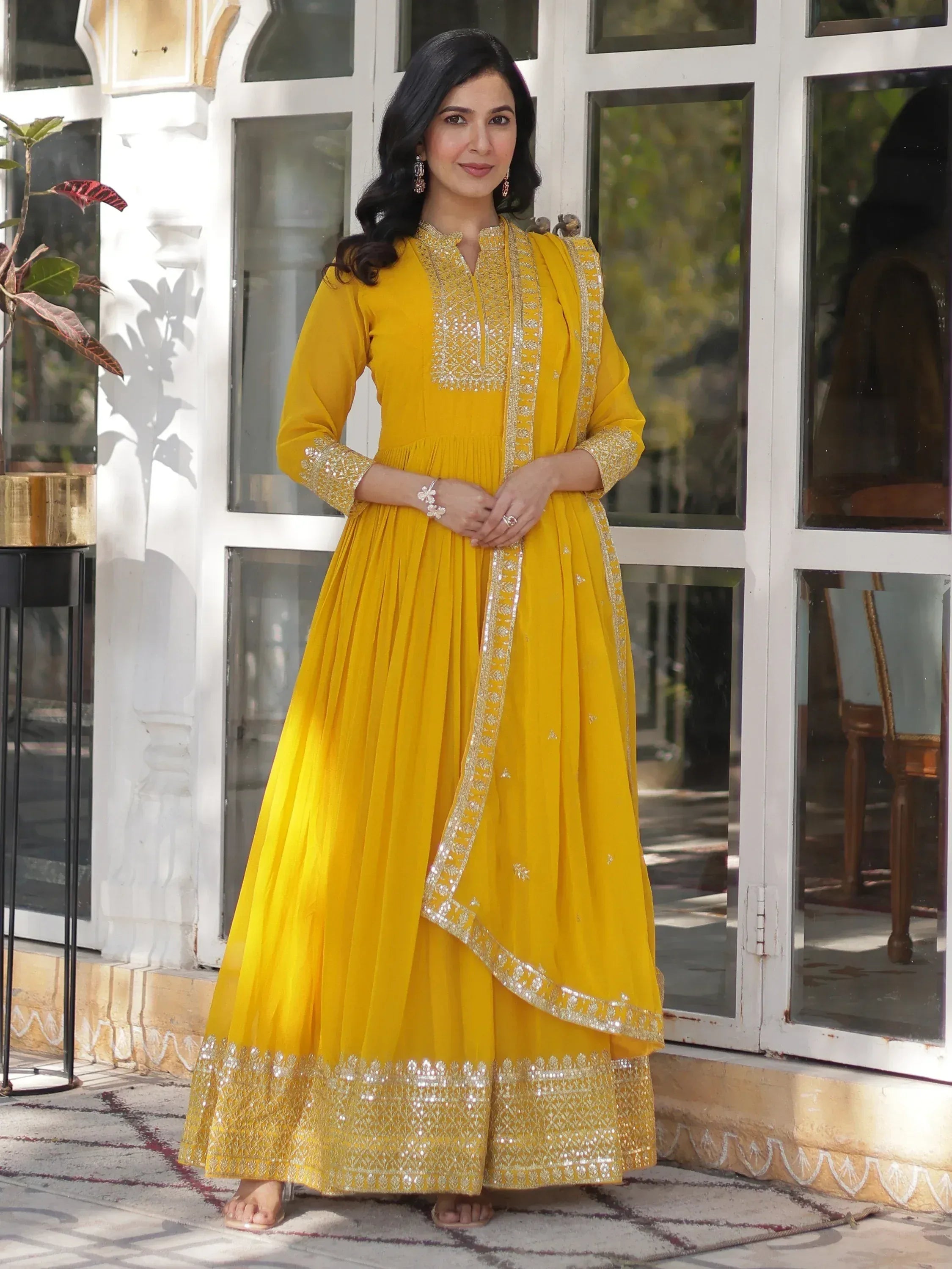 Yellow designer anarkali suit with gold embroidery, perfect for ethnic occasions