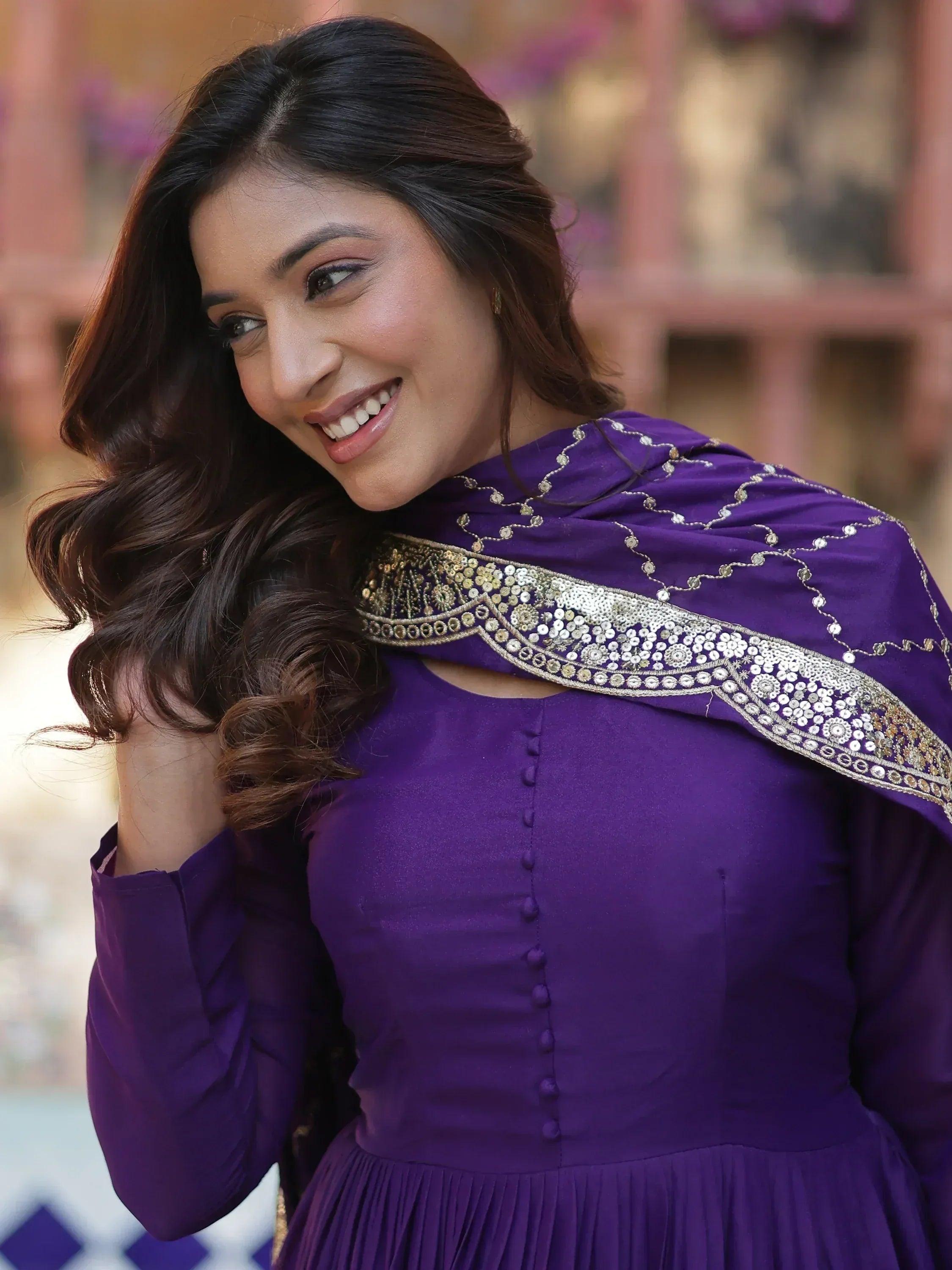 Purple ethnic gown with gold embroidery, perfect for Indian festive wear and designer occasions