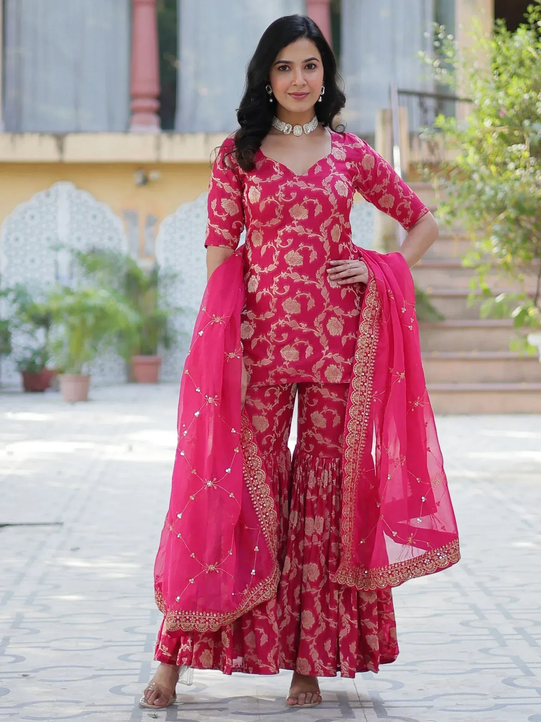 Pink floral printed palazzo suit with gold embroidery and matching dupatta, ideal for Indian ethnic occasions