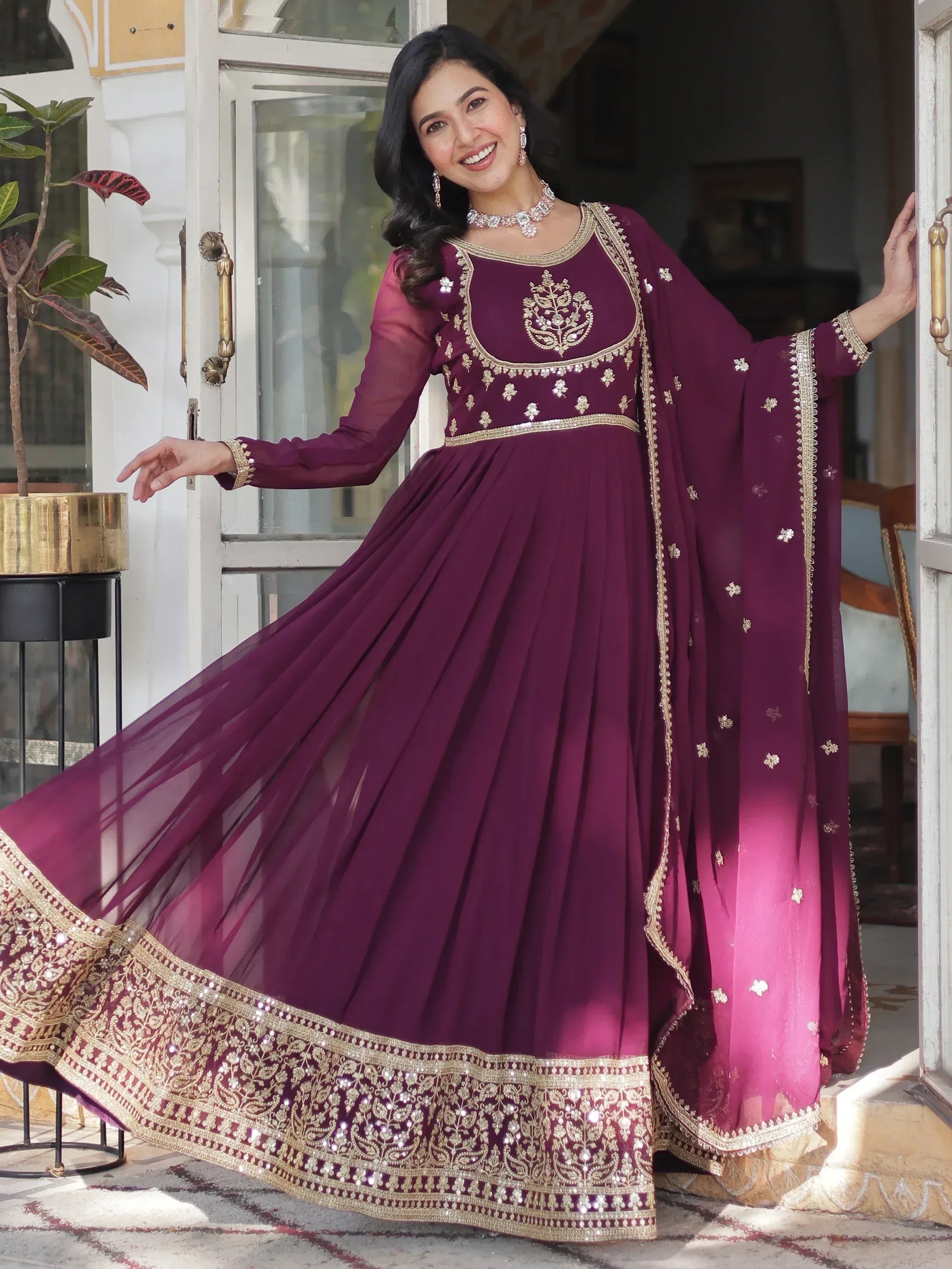 Elegant maroon anarkali with gold embroidery, perfect for Indian ethnic occasions and festive wear.
