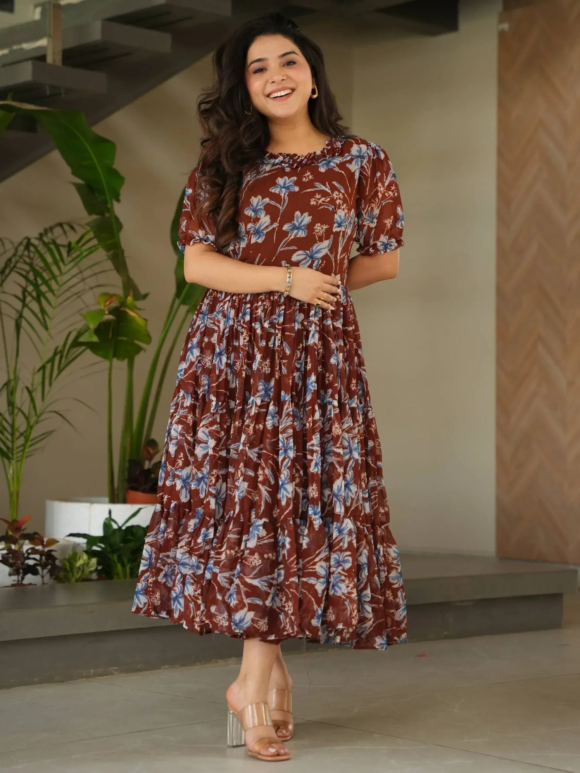 Brown floral print ethnic gown with puff sleeves and ruffled hem, perfect for Indian occasions