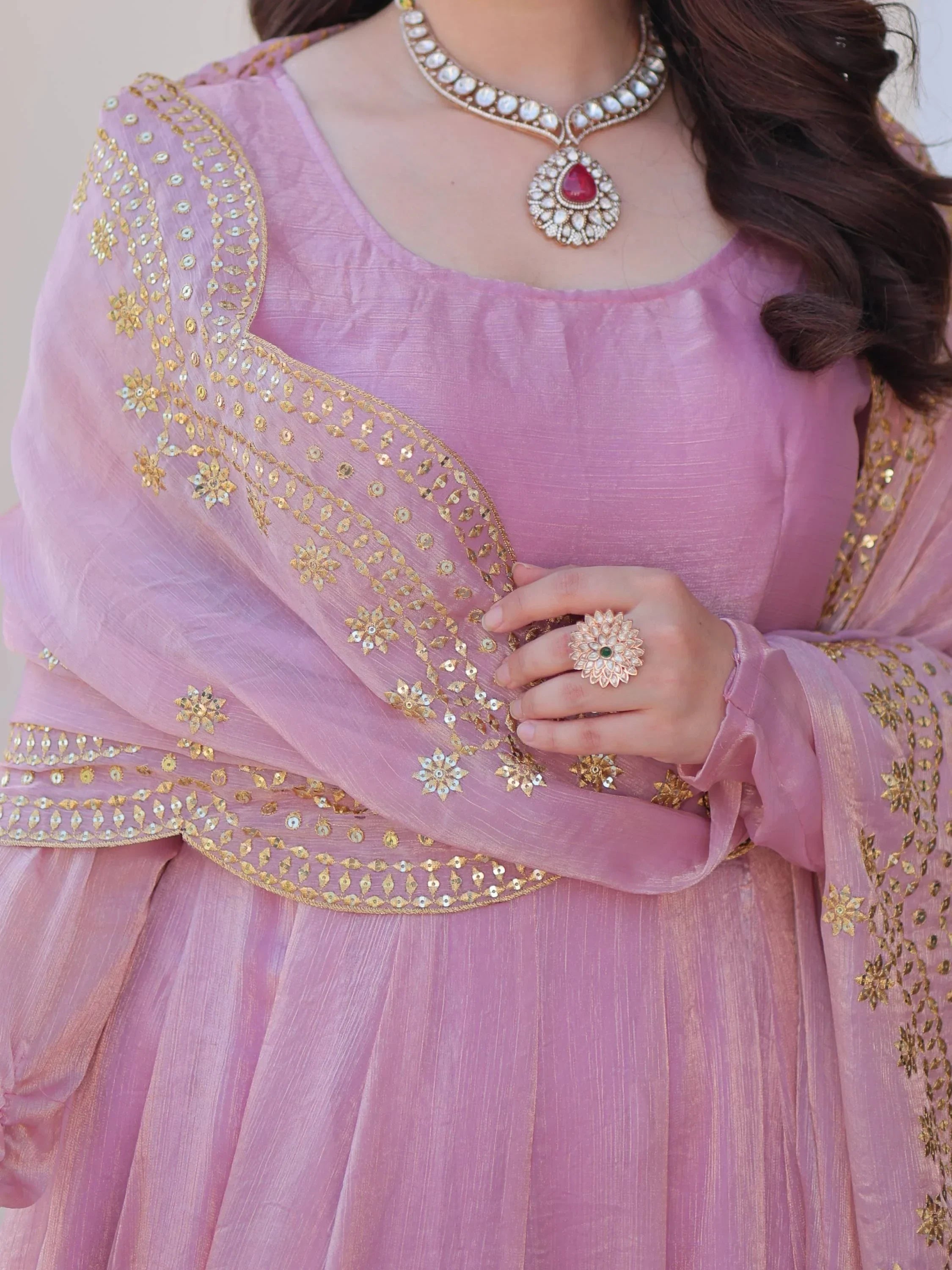 Pink ethnic gown with gold embroidery, matching dupatta, statement necklace and ring
