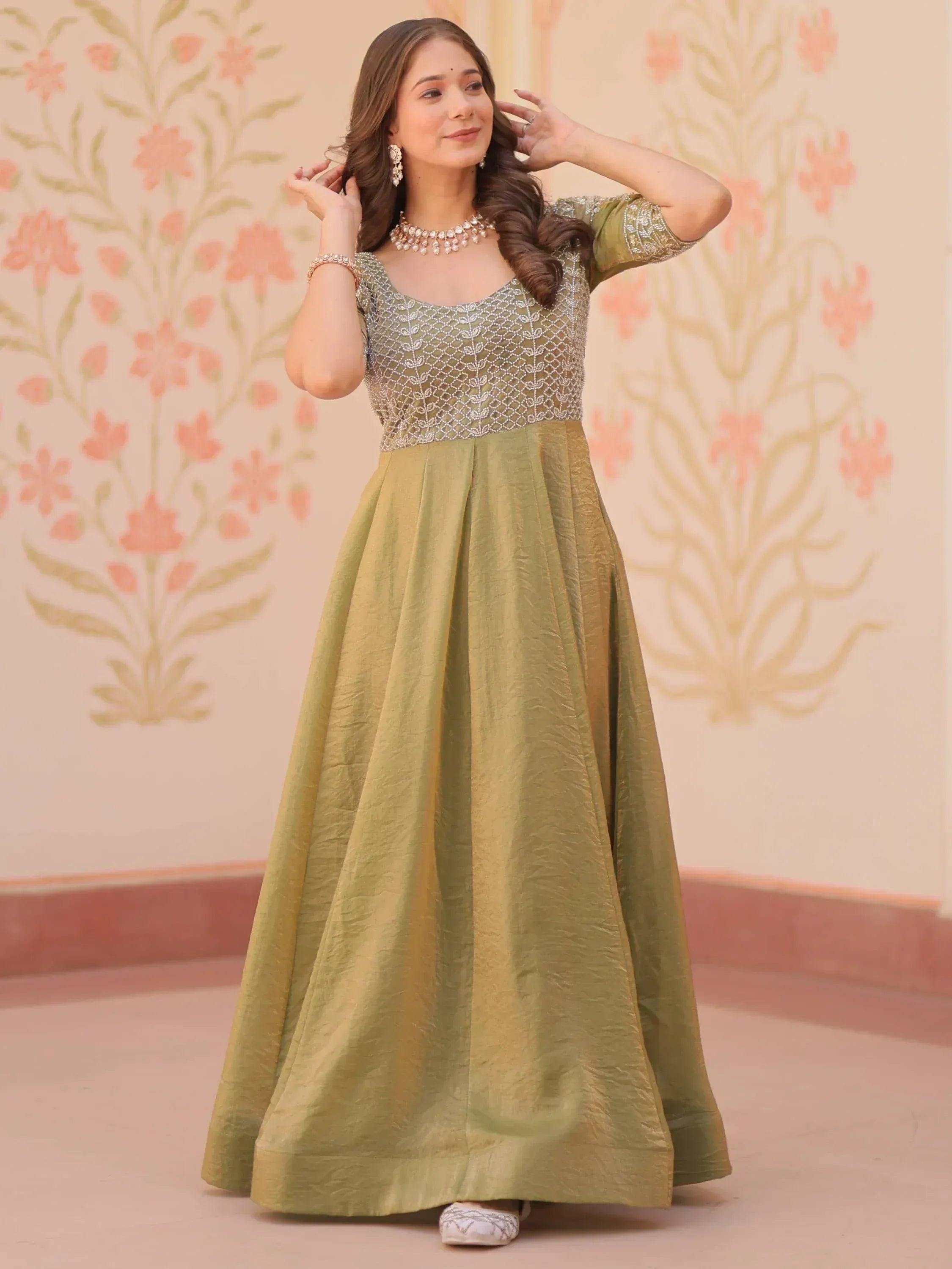 Olive green ethnic gown with embroidered bodice, perfect for Indian occasions and festive wear.