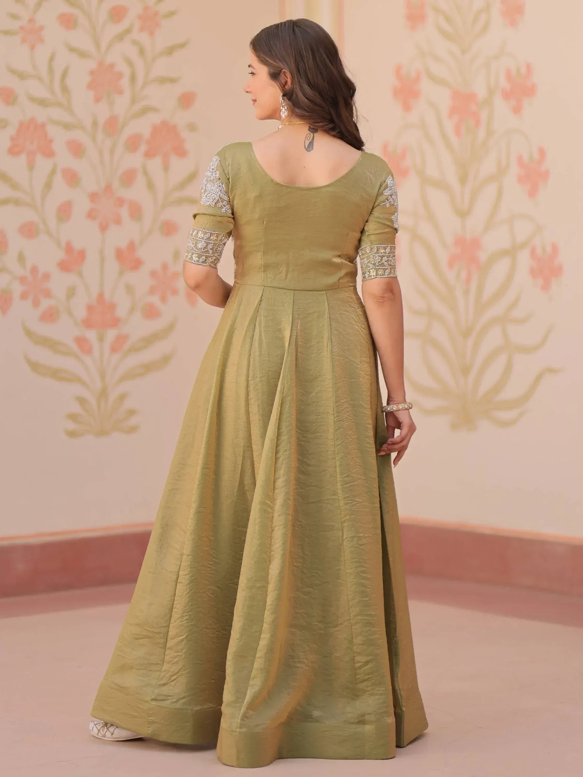 Olive green ethnic gown with embroidered sleeves, perfect for Indian celebrations
