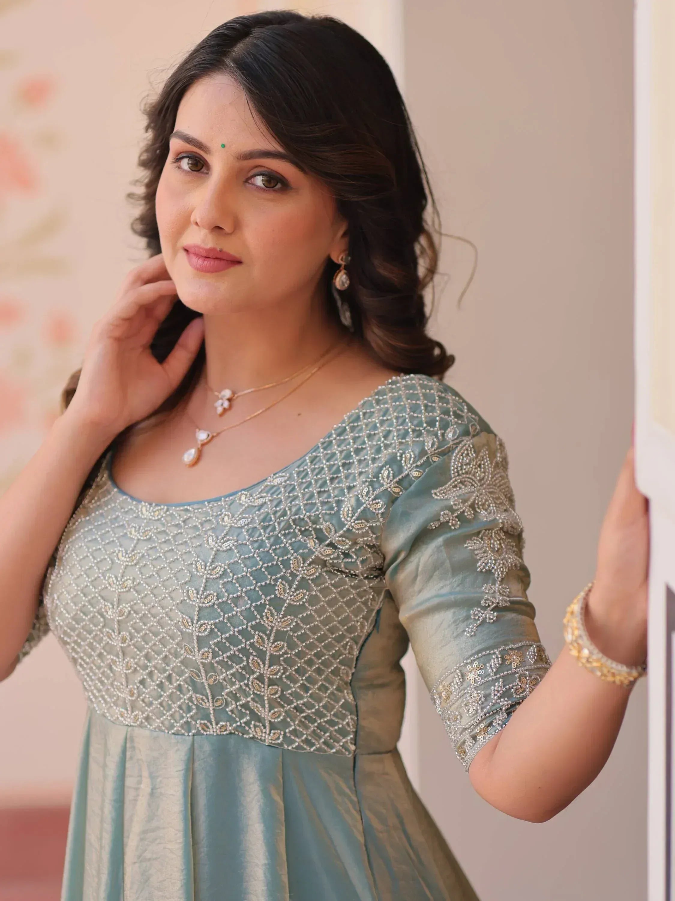 Elegant mint green ethnic gown with intricate beadwork and floral embroidery for women