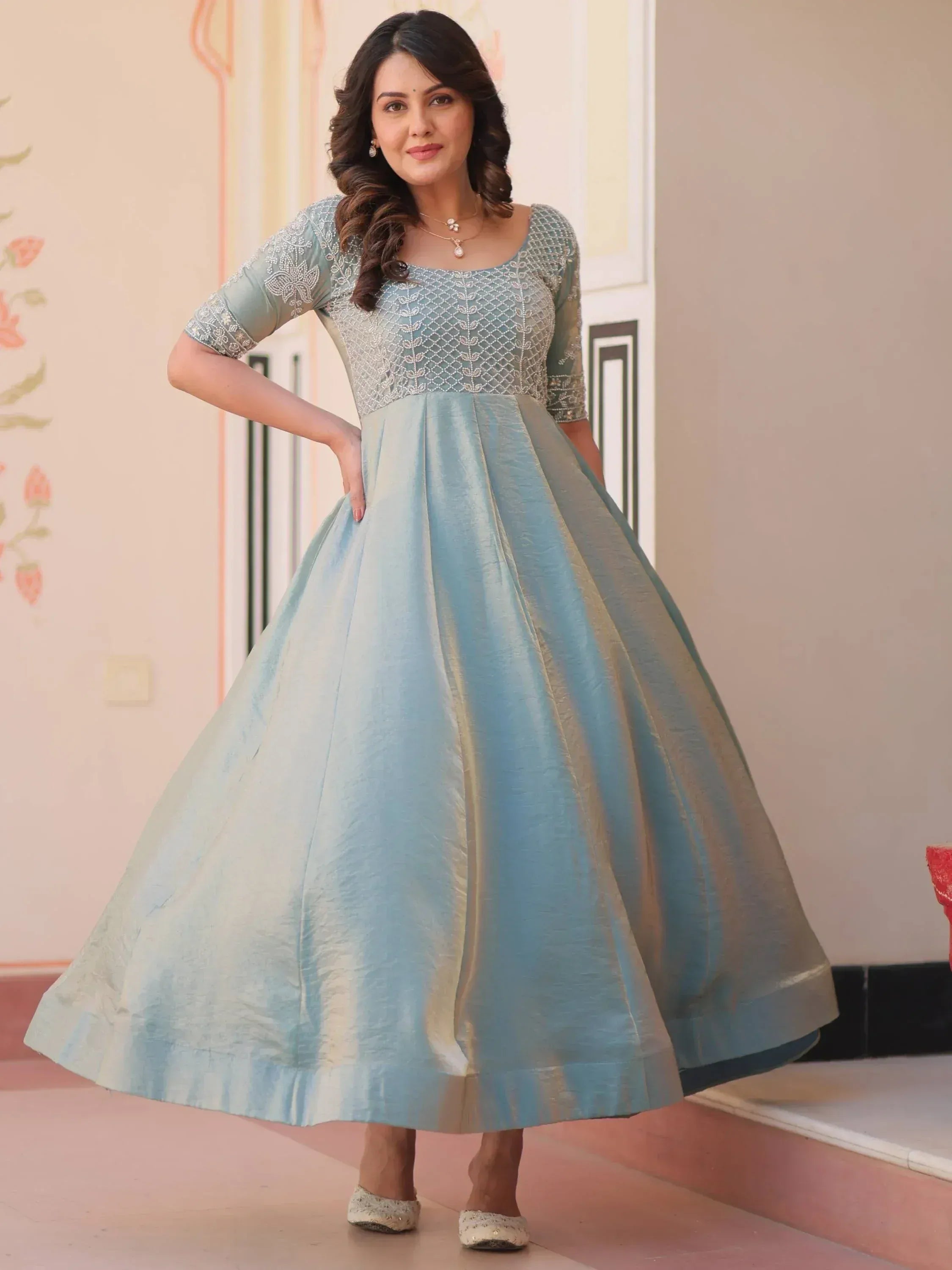 Light blue ethnic gown with silver embroidery, perfect for Indian occasions and festive wear.