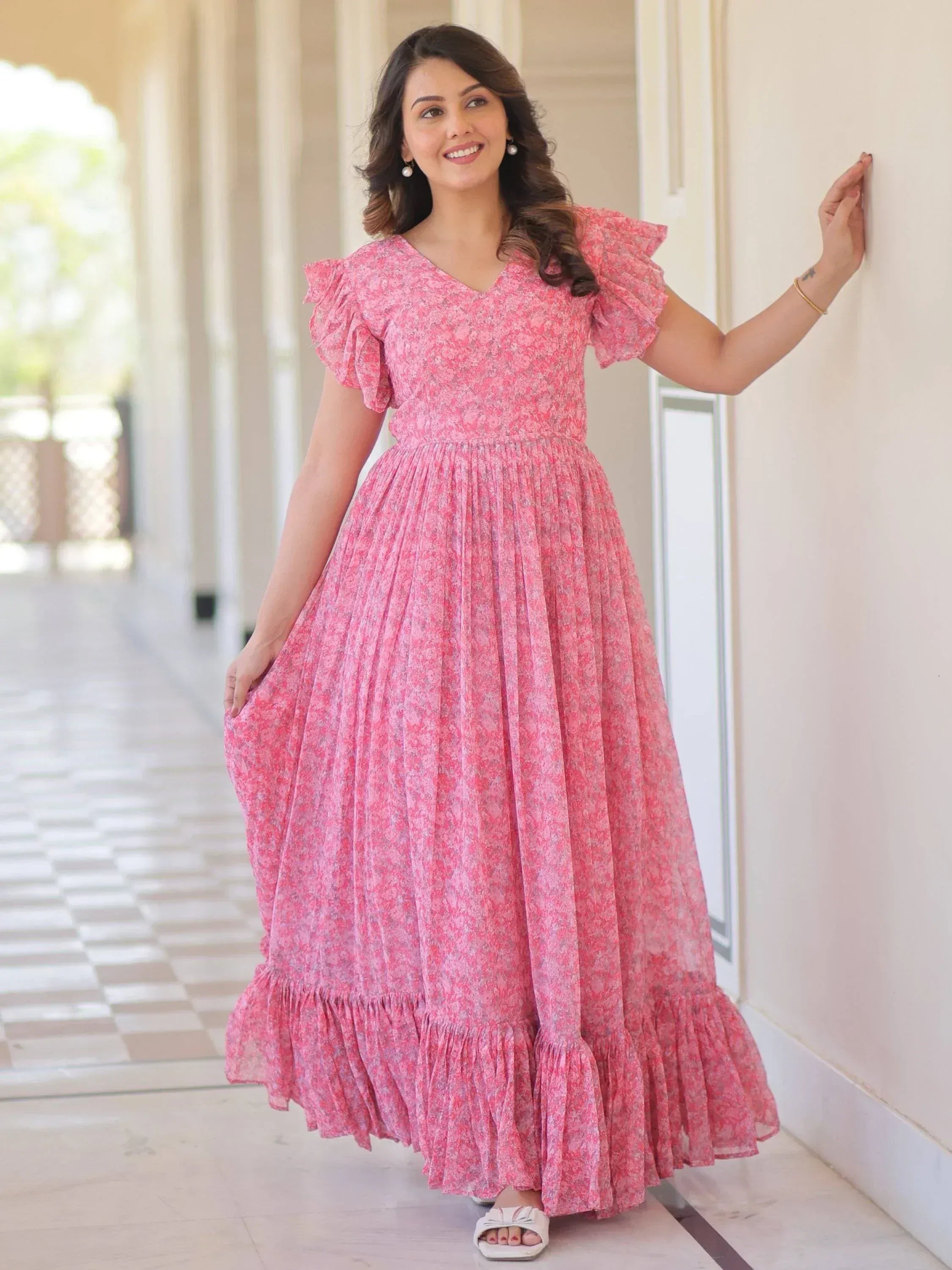 Pink floral ethnic gown with ruffle sleeves and pleated skirt, perfect for Indian occasions