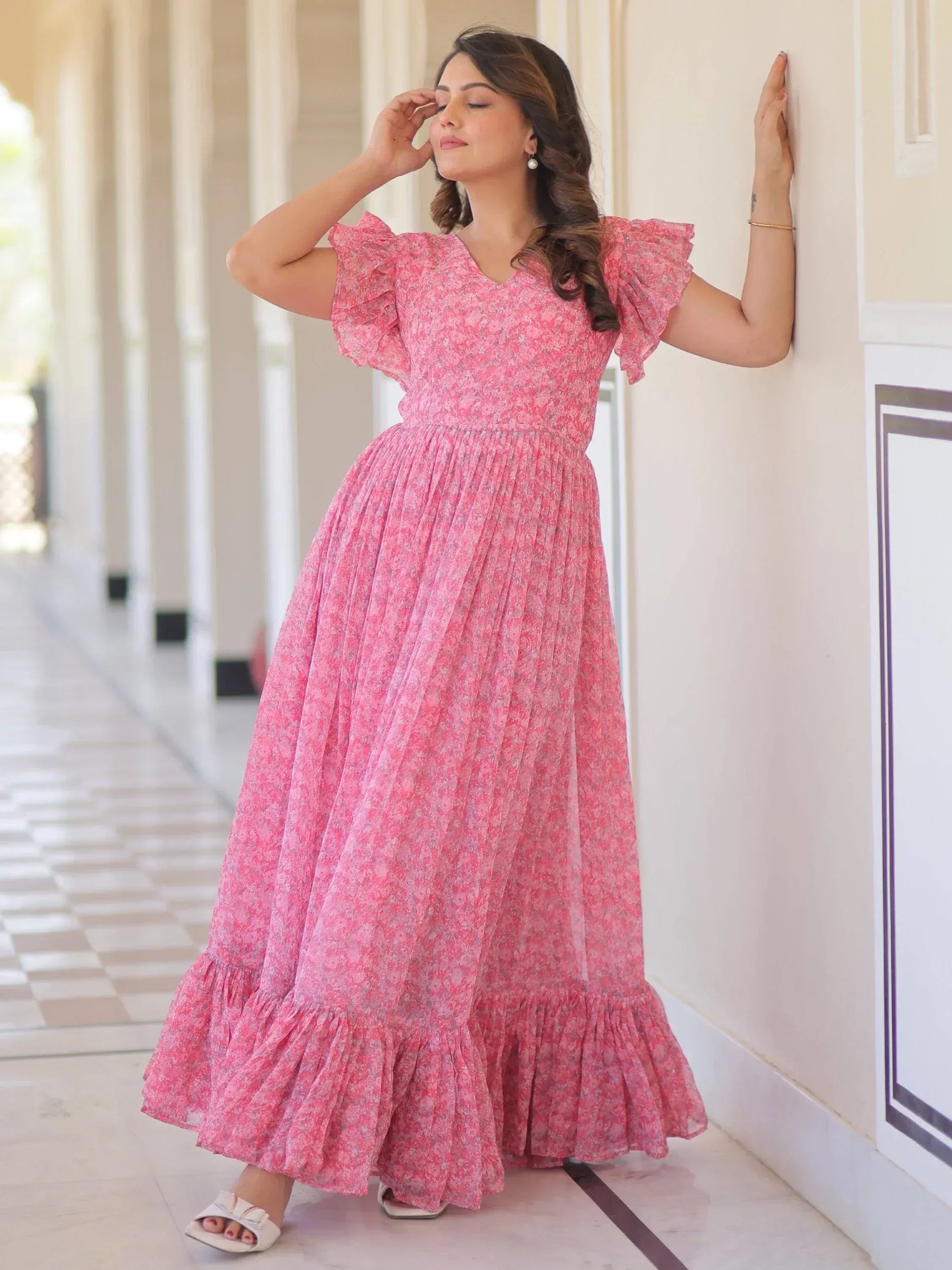 Pink floral ethnic gown with ruffle sleeves and pleated skirt, perfect for Indian occasions