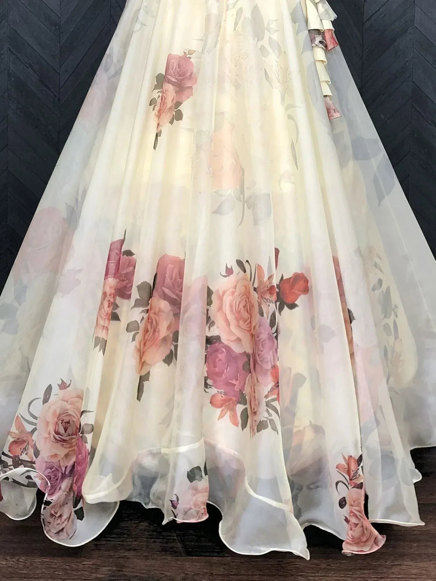 Floral print ethnic gown with ruffled hem, soft pastel roses on sheer fabric, perfect for Indian occasions