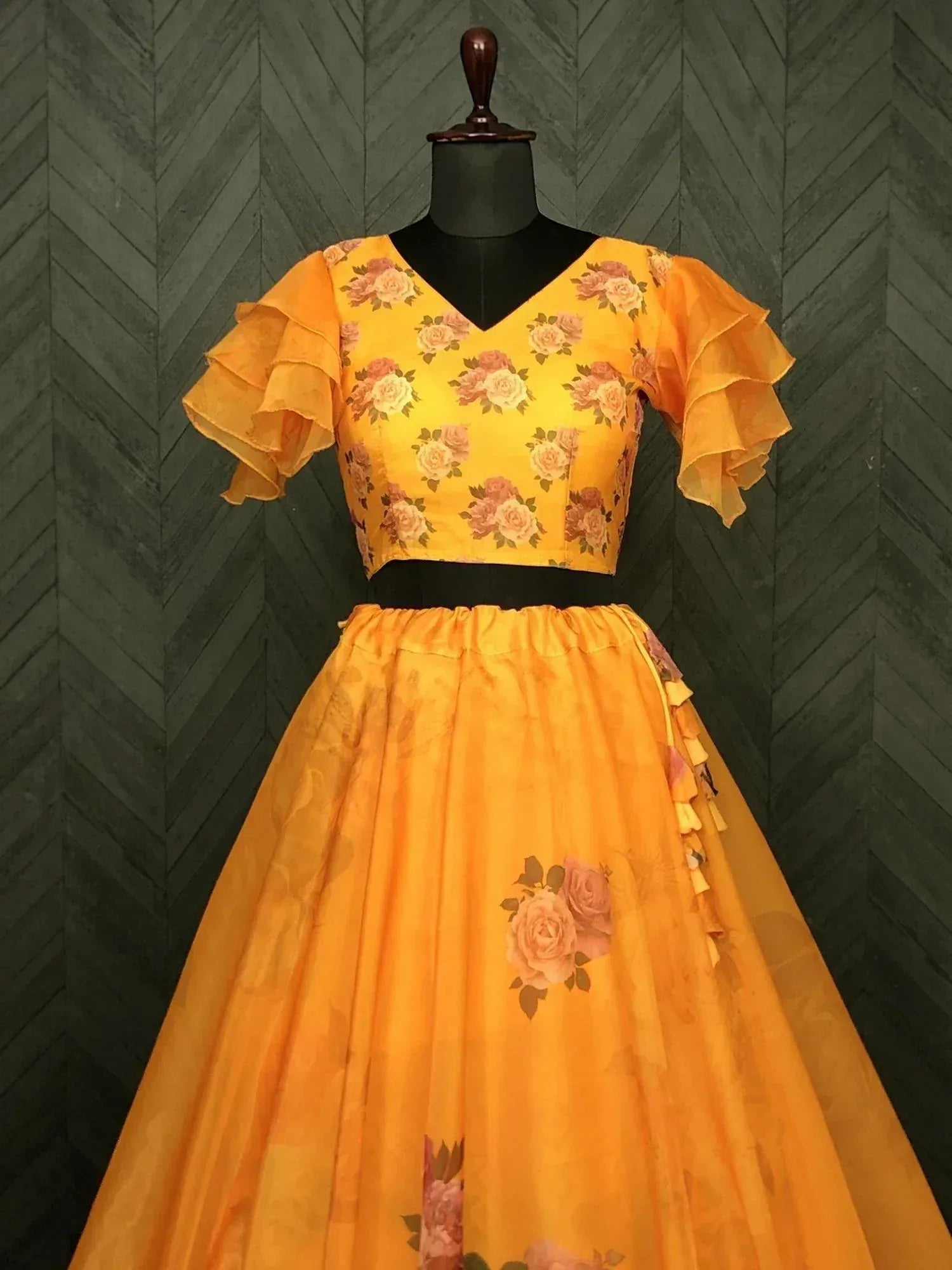 Yellow floral lehenga choli with ruffled sleeves, perfect for ethnic occasions