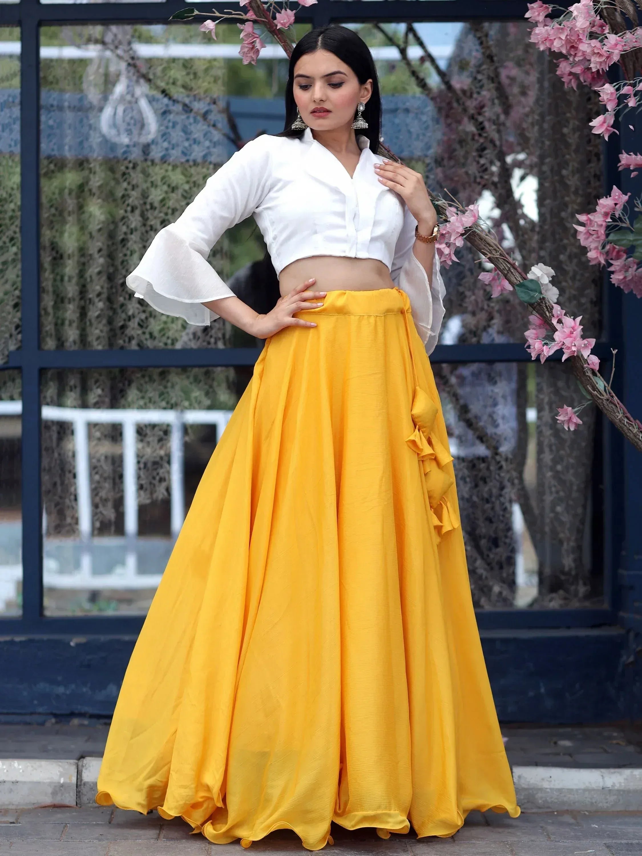 Yellow lehenga skirt with white crop top, ethnic wear for women, floral backdrop