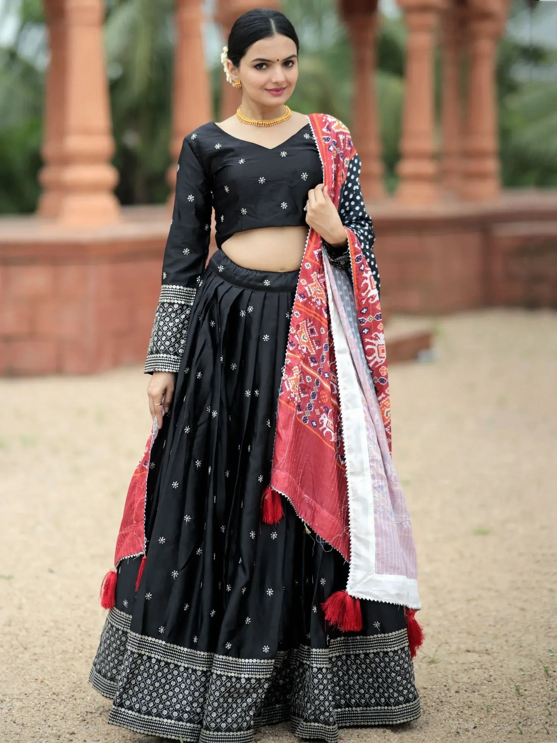 Black embroidered lehenga choli with red patterned dupatta, Indian ethnic wear for women