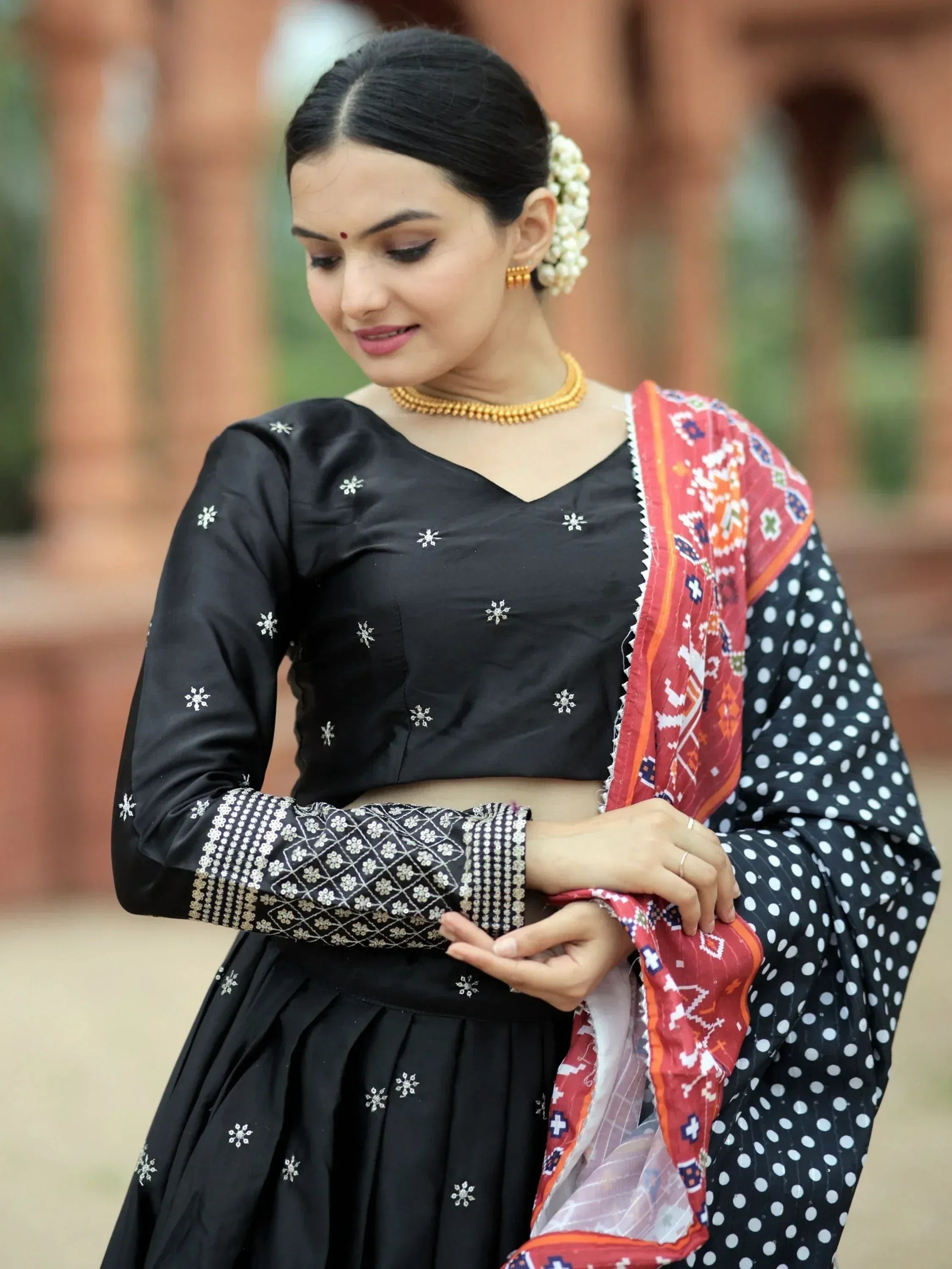 Black embroidered lehenga choli with polka dot dupatta, traditional Indian ethnic wear