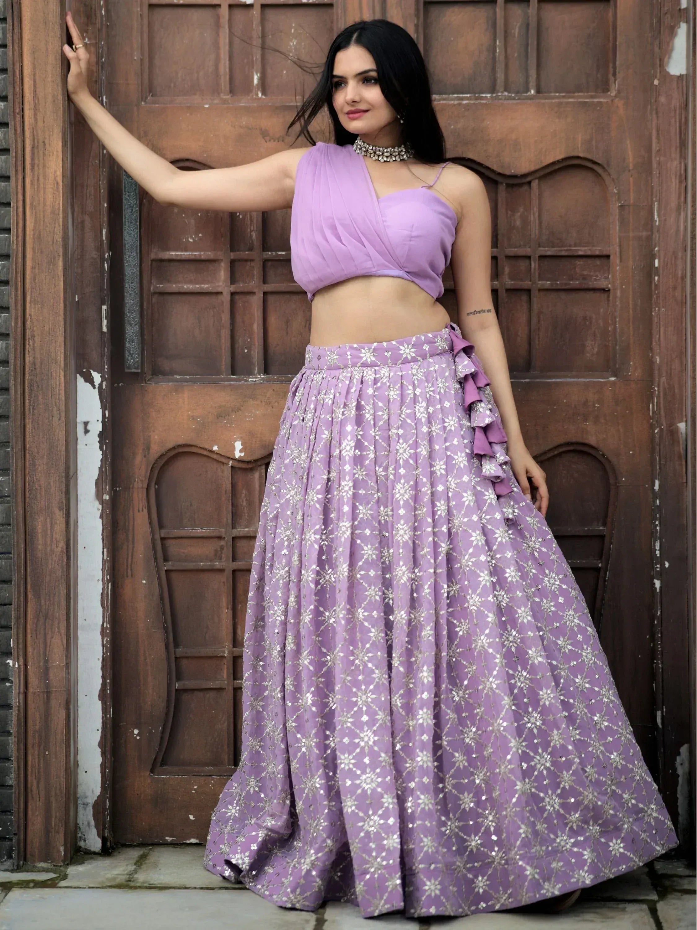 Lavender lehenga choli with silver embroidery and ruffle detailing, perfect for Indian ethnic wear occasions