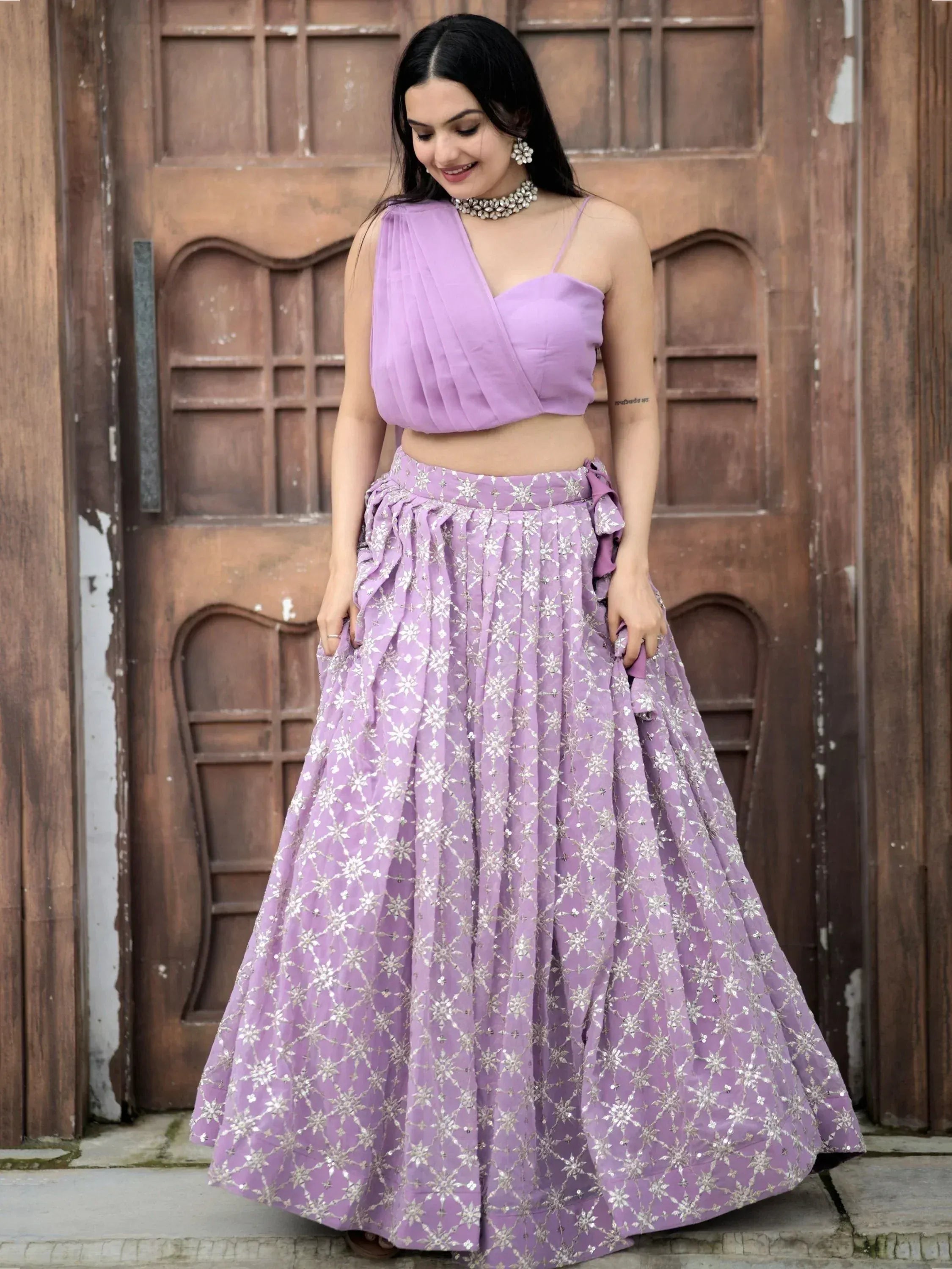 Lavender designer lehenga choli with silver embroidery, perfect for Indian ethnic wear occasions.