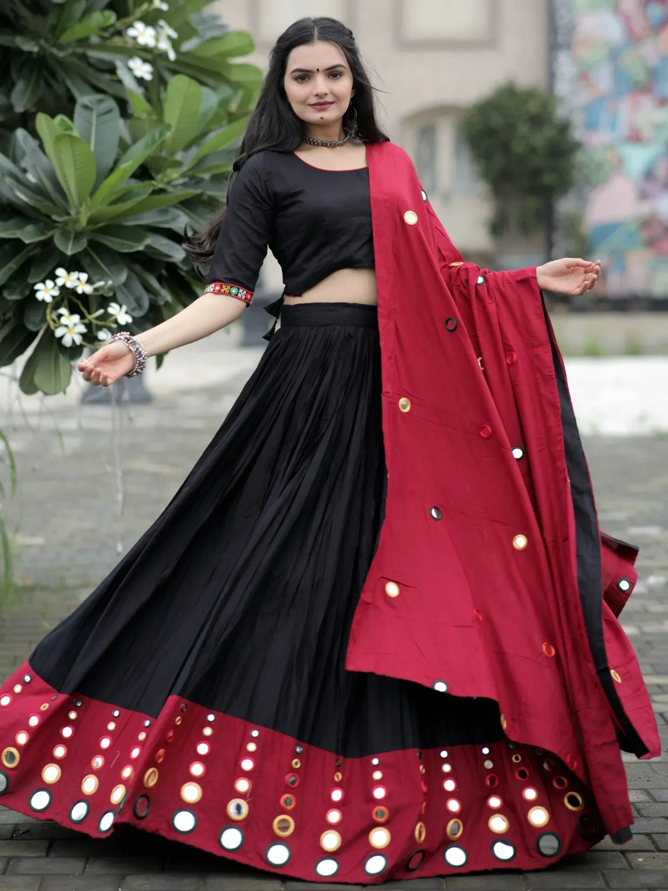 Black and maroon mirror work lehenga choli with pleated skirt and dupatta, perfect for Indian ethnic wear