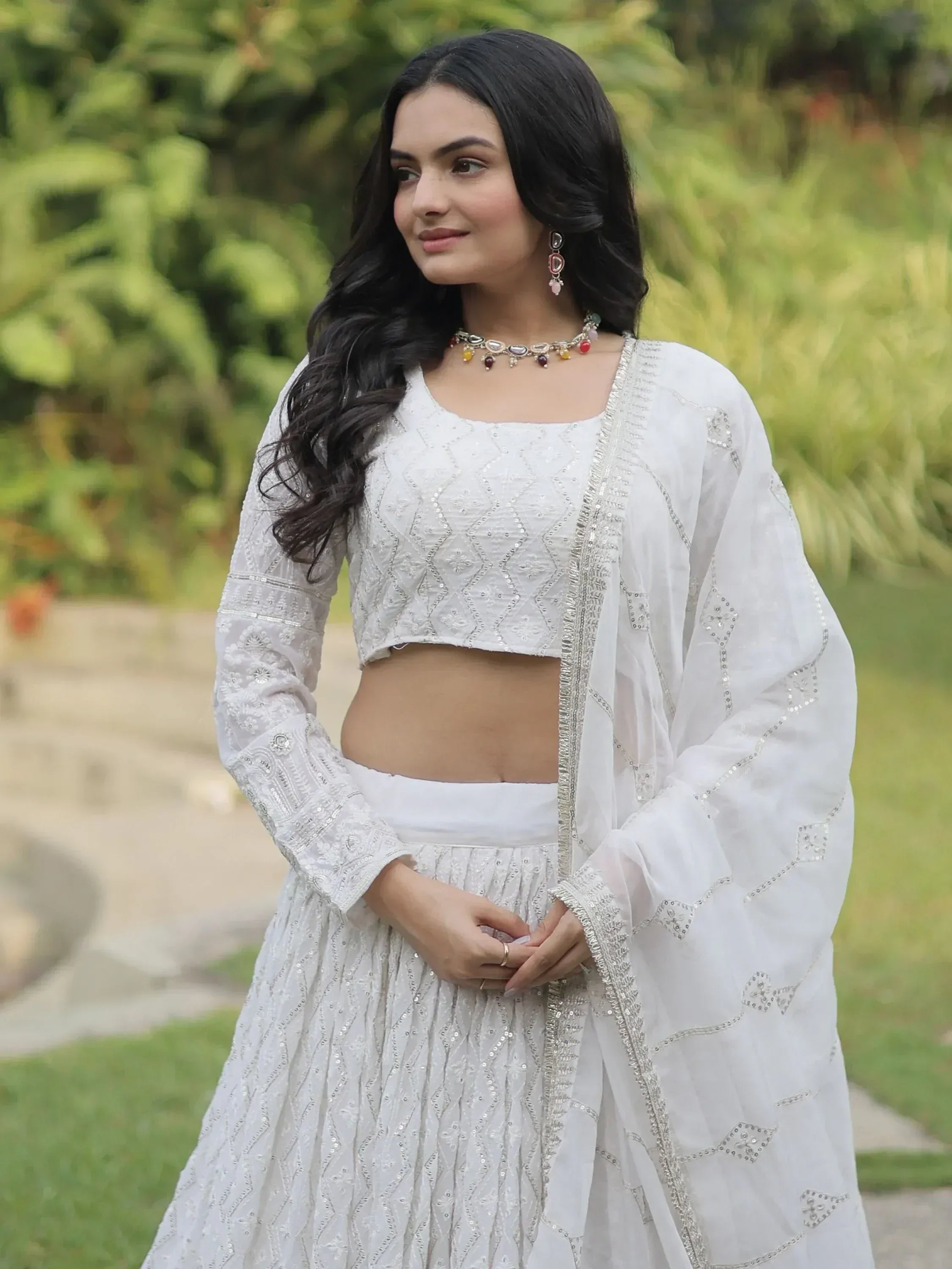 White embroidered lehenga choli with sheer dupatta, perfect for Indian ethnic occasions