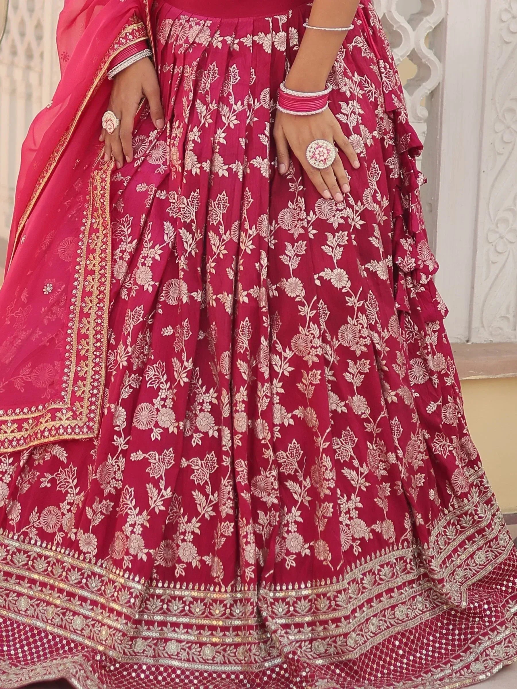 Pink floral embroidered lehenga choli with gold detailing and dupatta, perfect for Indian ethnic wear occasions.