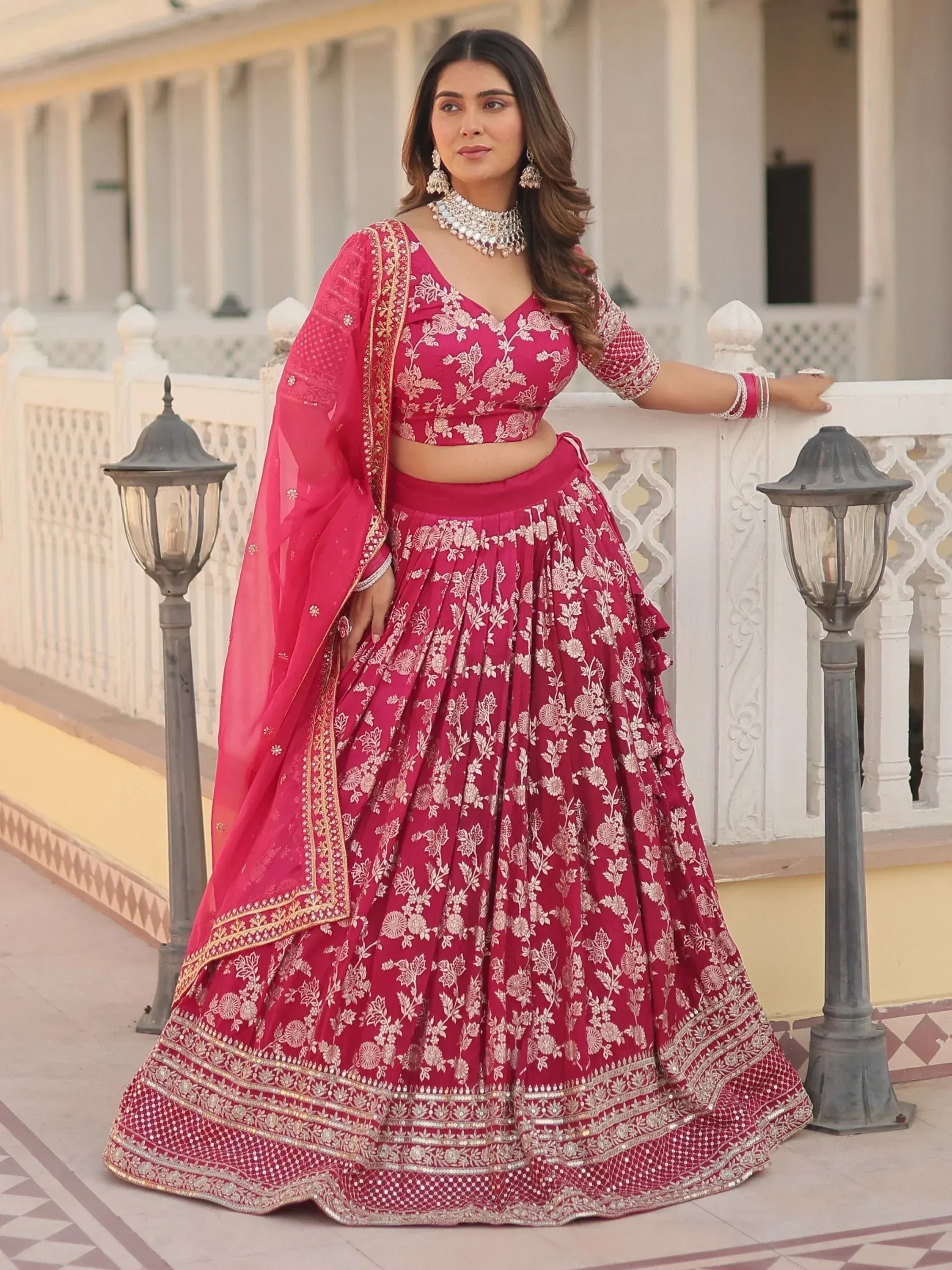 Pink floral embroidered lehenga choli with dupatta, perfect for Indian weddings and festive occasions