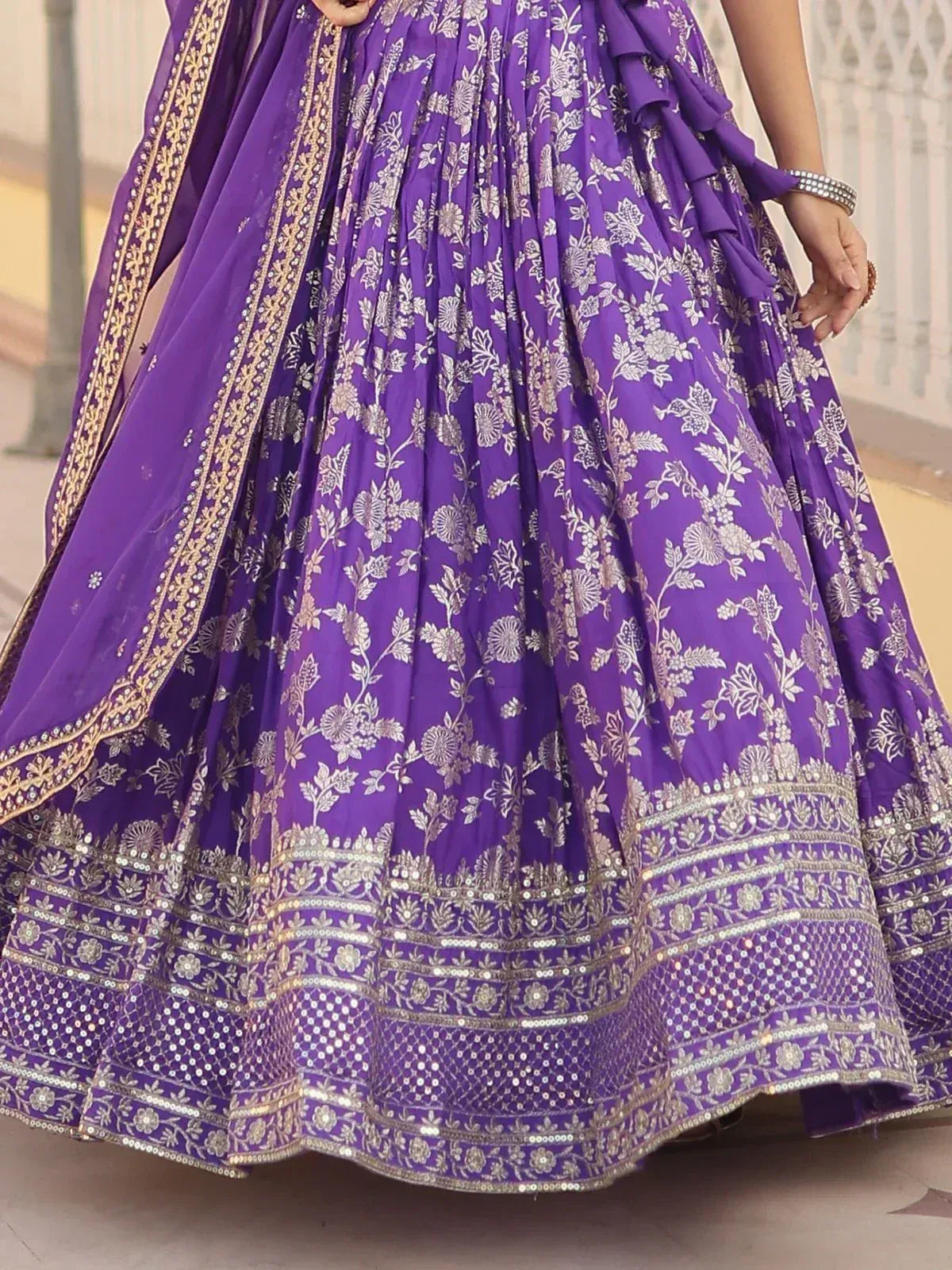 Purple floral embroidered lehenga with gold border and sequin detailing, perfect for Indian ethnic wear