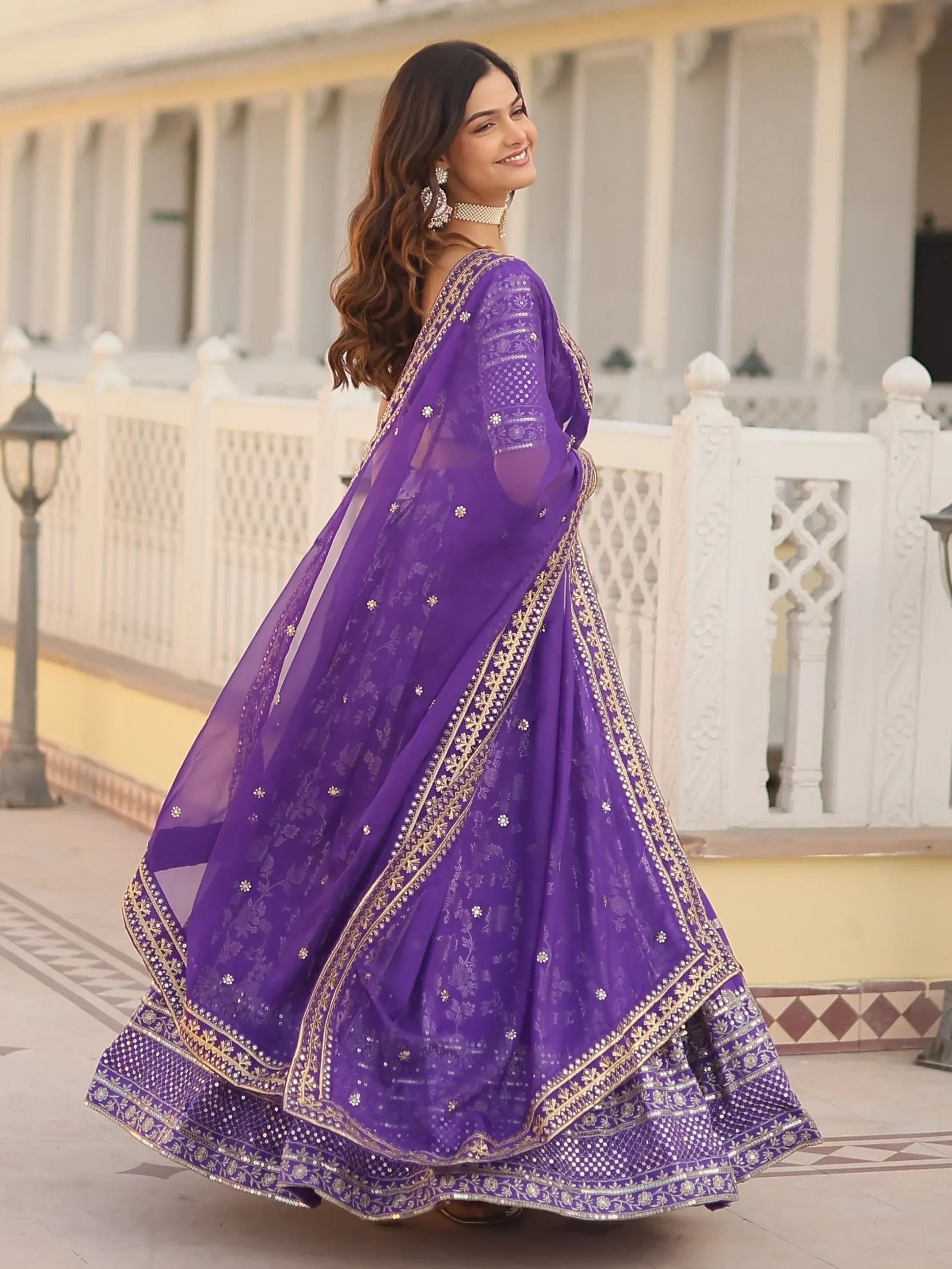 Purple designer lehenga choli with gold embroidery and sequins, perfect for Indian ethnic wear occasions