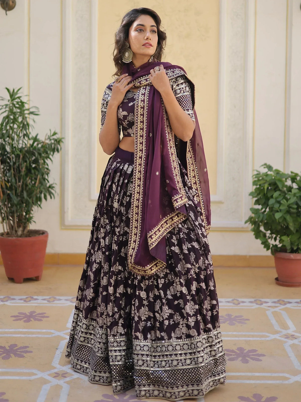 Purple designer lehenga choli with gold floral embroidery and matching dupatta, ideal for Indian ethnic wear