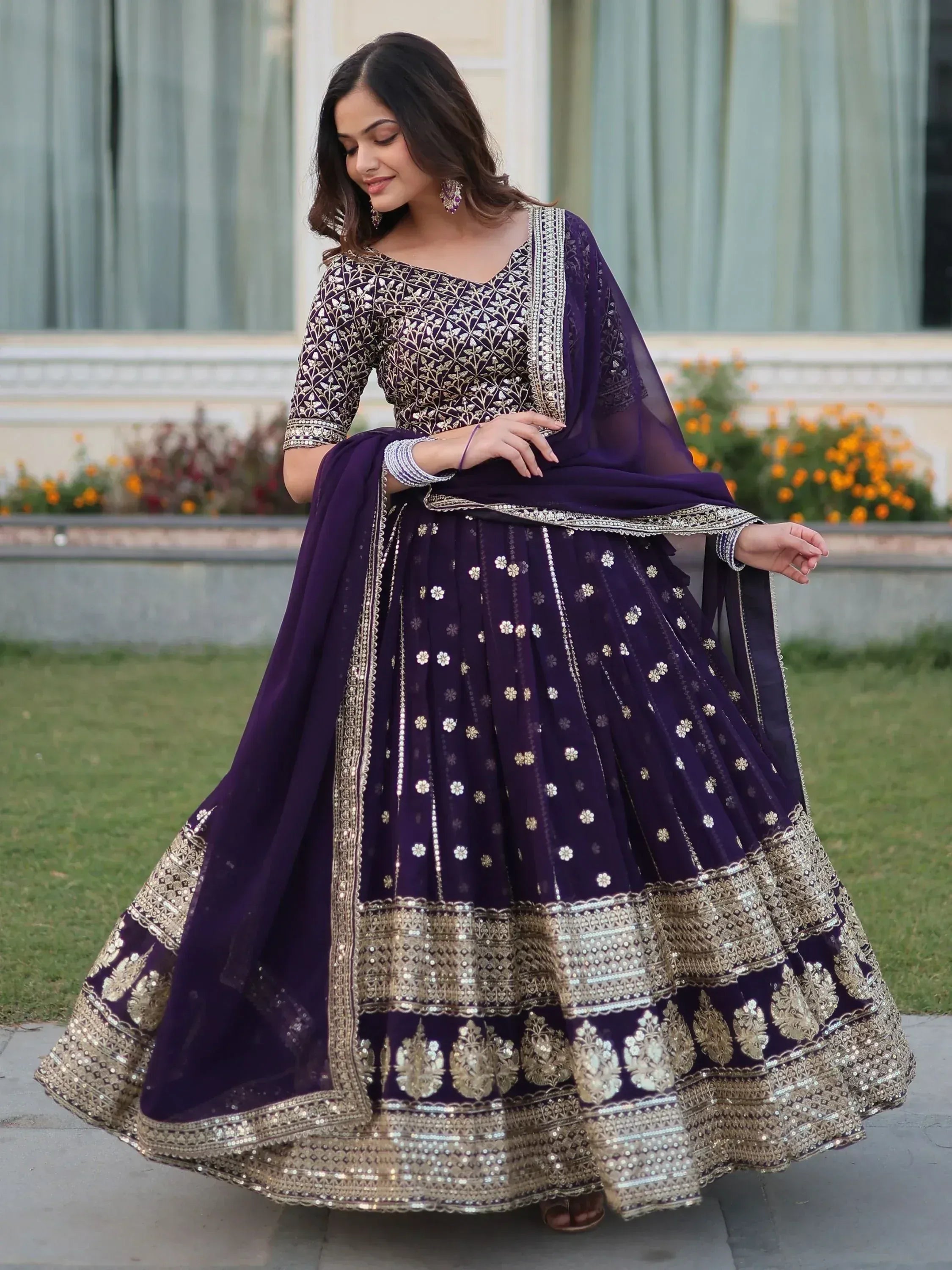 Elegant purple lehenga choli with gold embroidery, perfect for Indian ethnic wear and festive occasions.