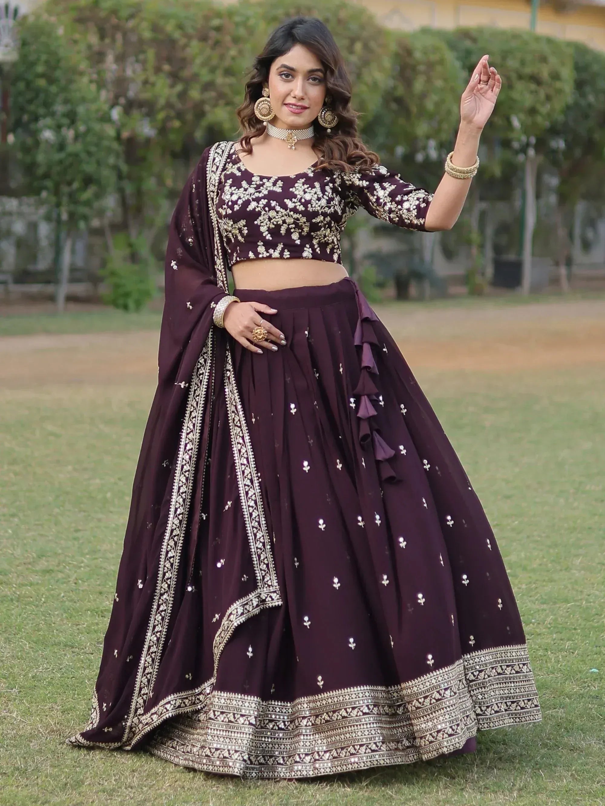 Elegant maroon lehenga choli with gold embroidery, perfect for Indian ethnic wear events