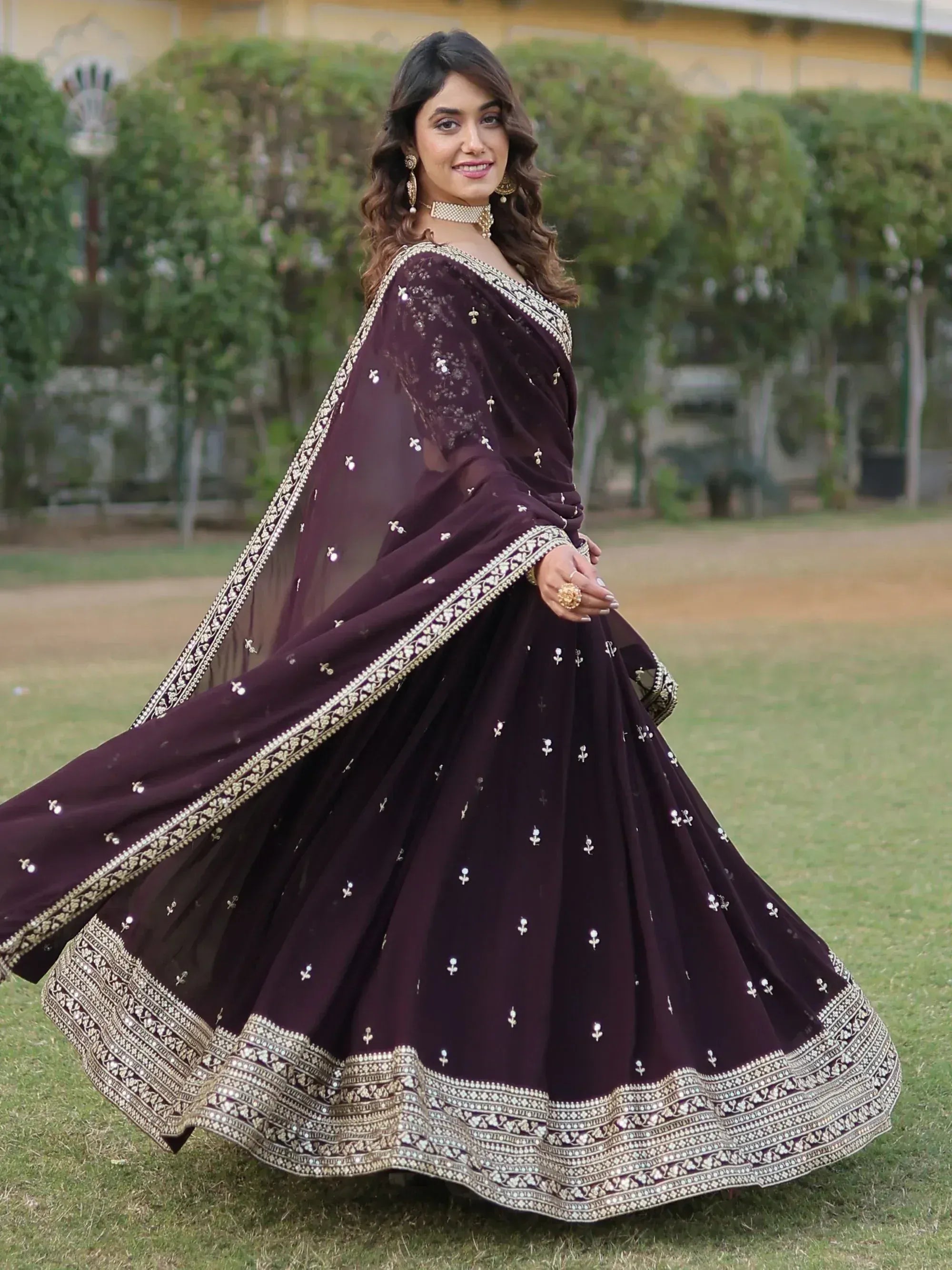 Elegant purple lehenga choli with gold embroidery, perfect for Indian ethnic wear and festive occasions.