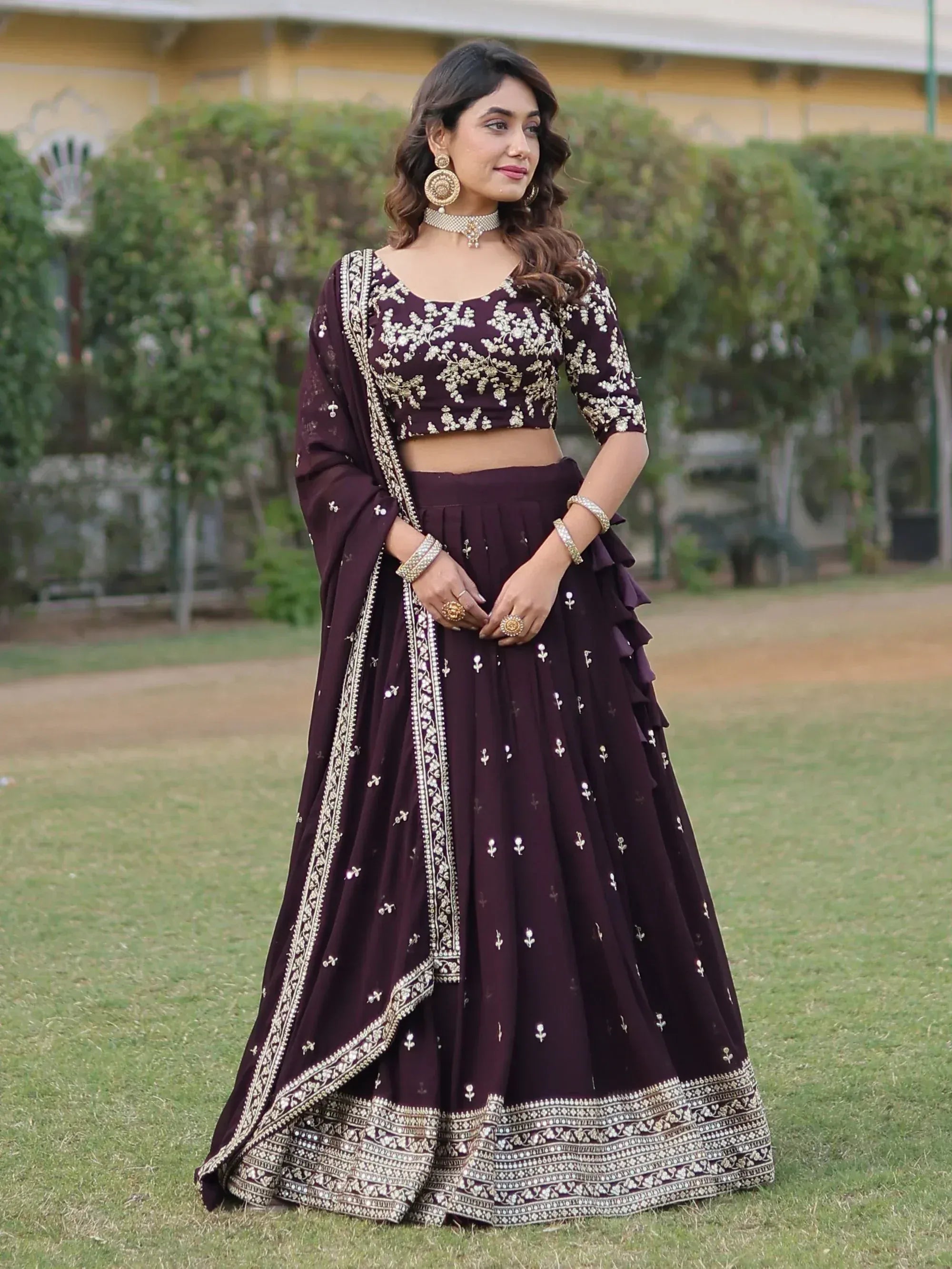 Elegant maroon lehenga choli with gold embroidery, perfect for Indian ethnic wear and festive occasions.