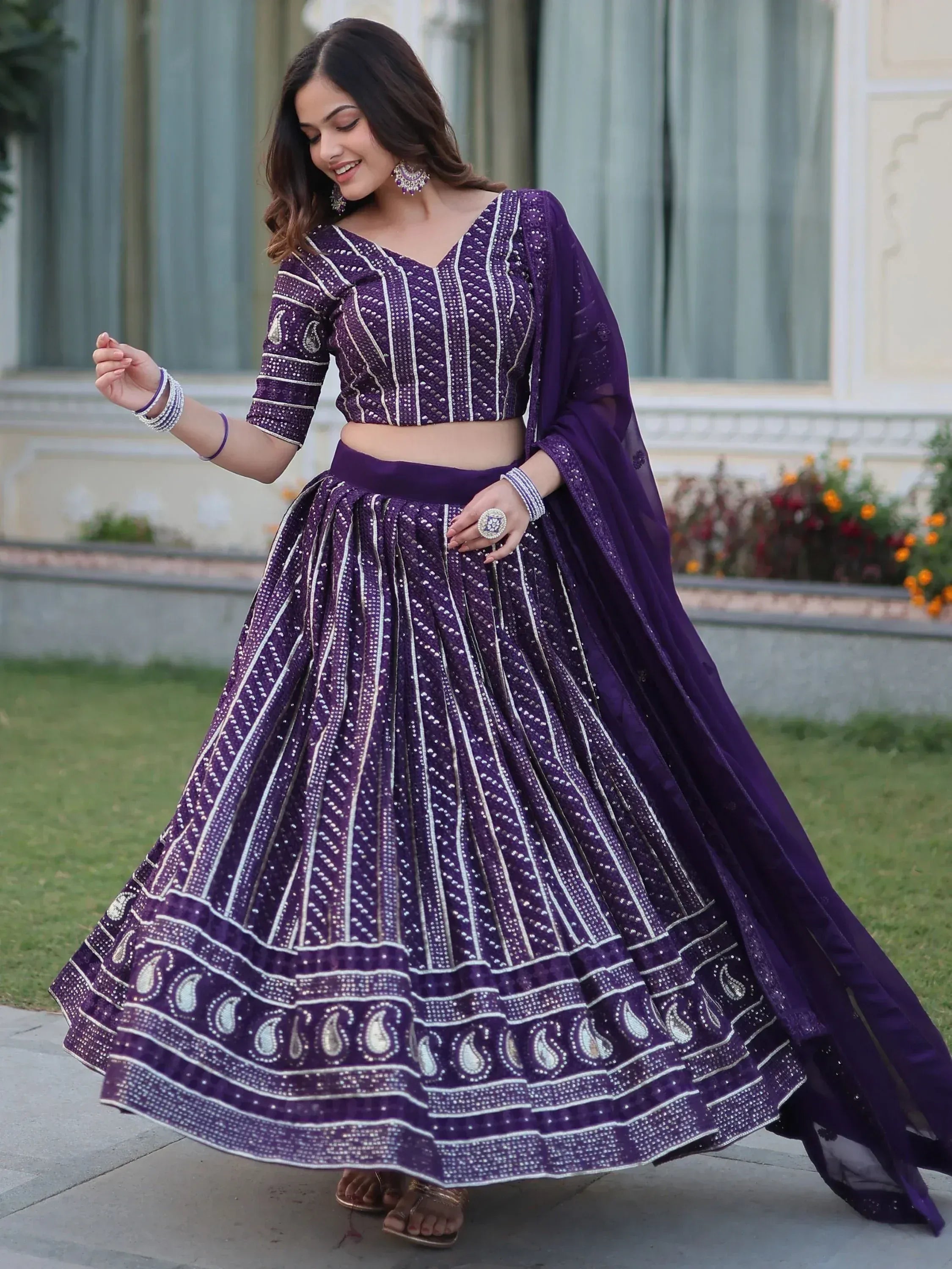 Purple embroidered lehenga choli with silver detailing, perfect for Indian ethnic wear events