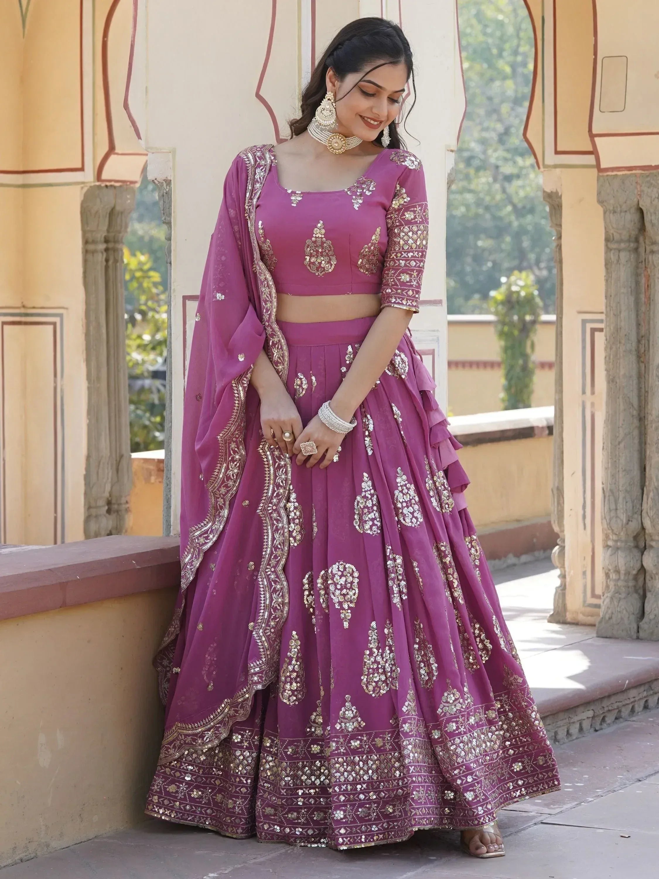 Purple designer lehenga choli with gold embroidery, perfect for Indian ethnic wear and festive occasions.