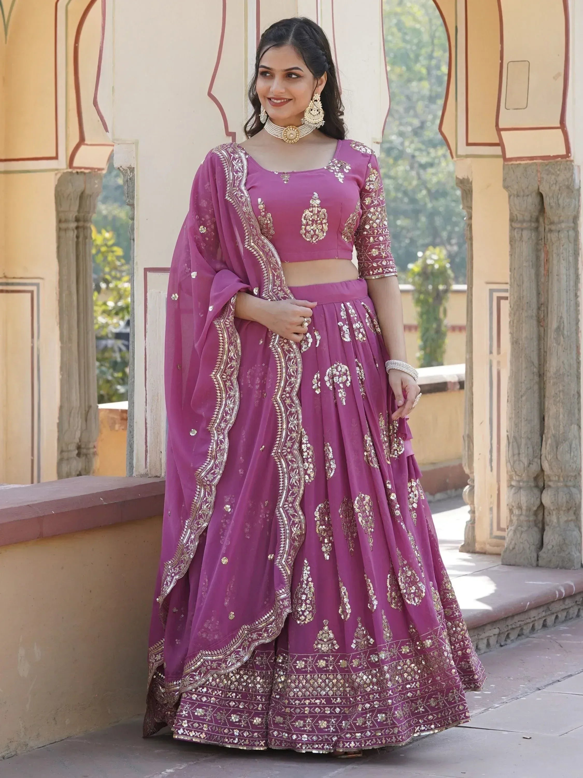 Purple embroidered lehenga choli with gold detailing, perfect for Indian ethnic wear and festive occasions.