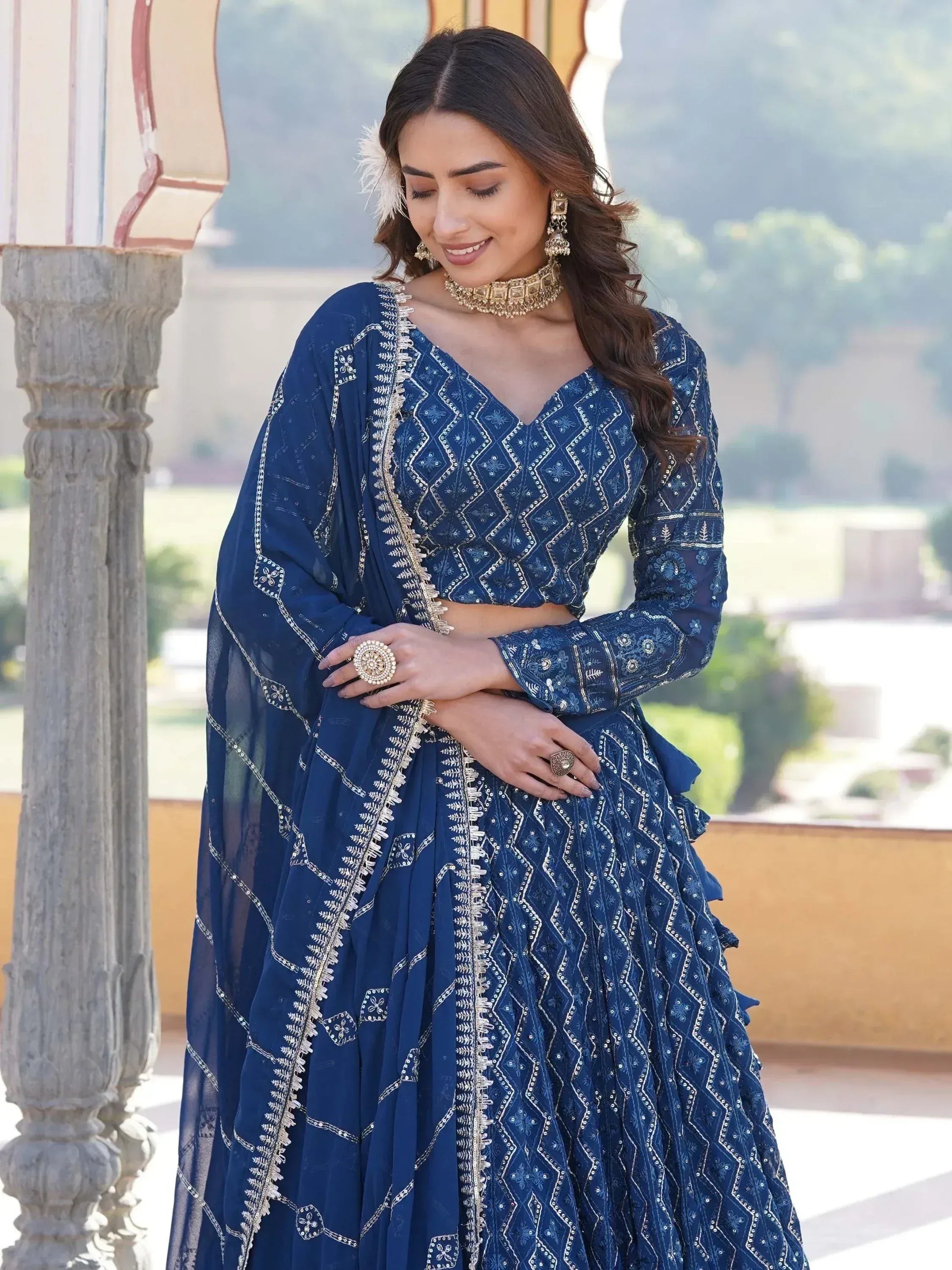 Elegant navy blue embroidered lehenga choli with gold detailing, perfect for Indian ethnic wear occasions.