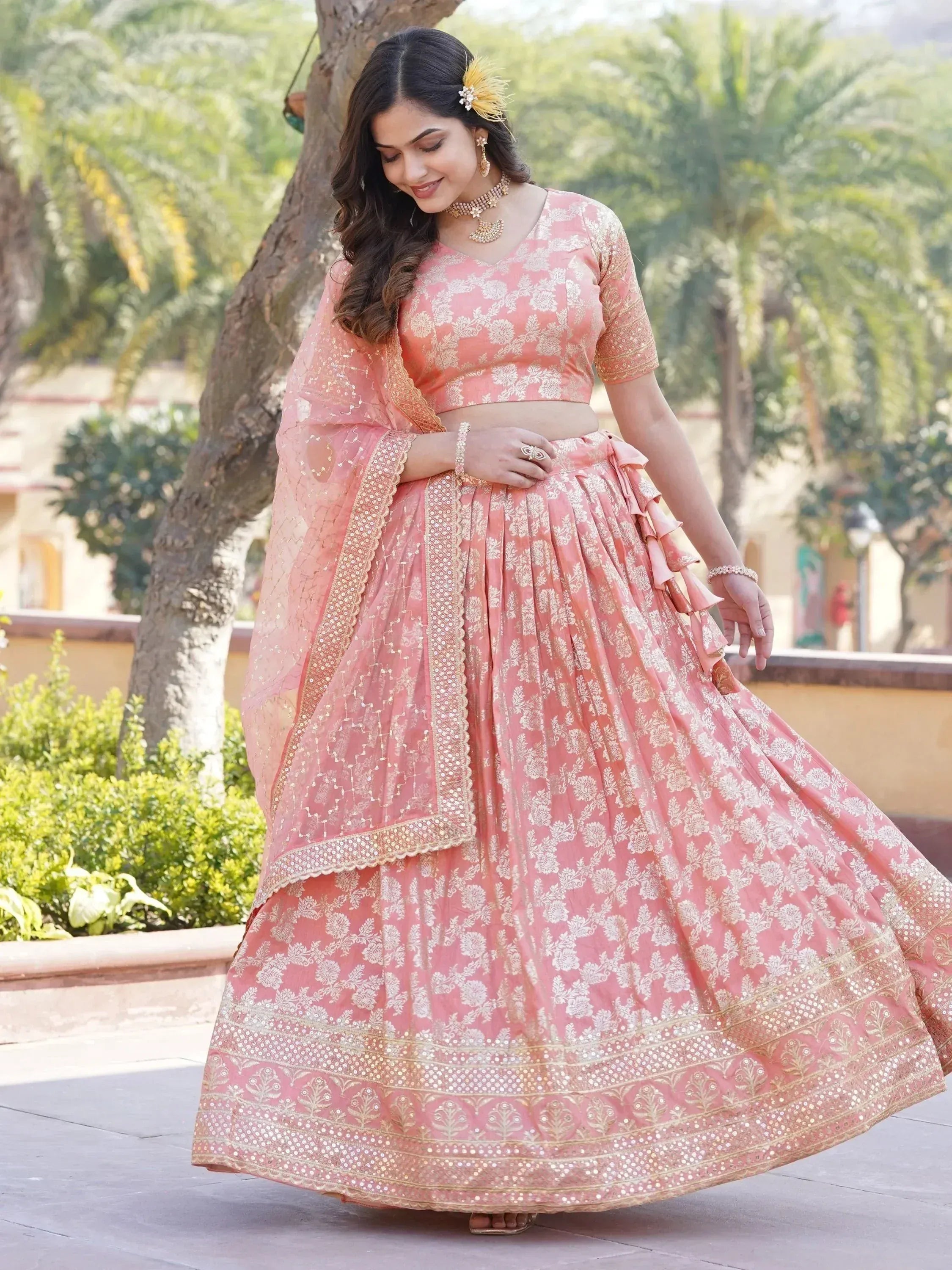 Pink floral lehenga choli with gold embroidery, perfect for Indian weddings and festive occasions