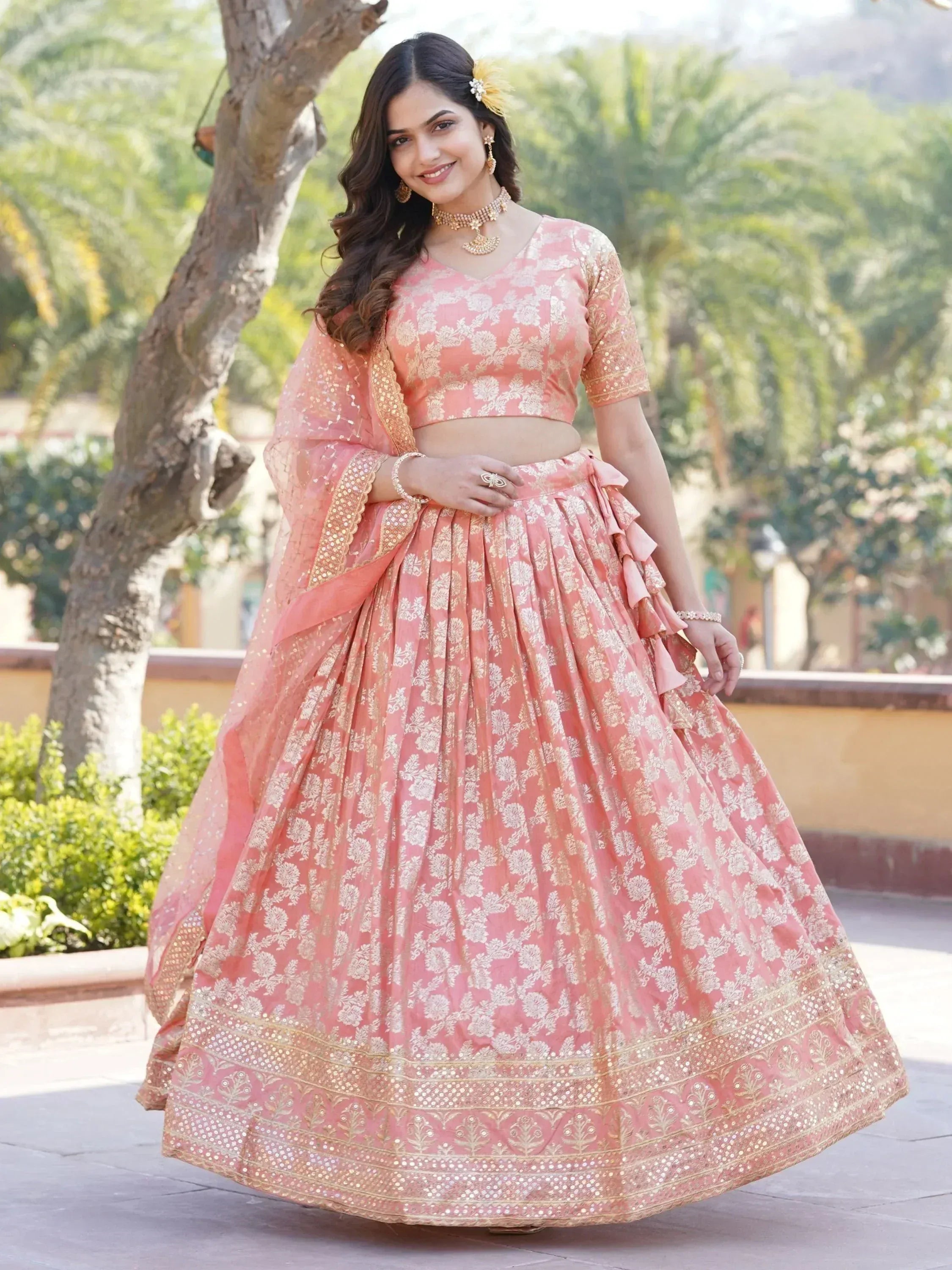 Pink floral lehenga choli with gold embroidery, perfect for Indian weddings and festive occasions