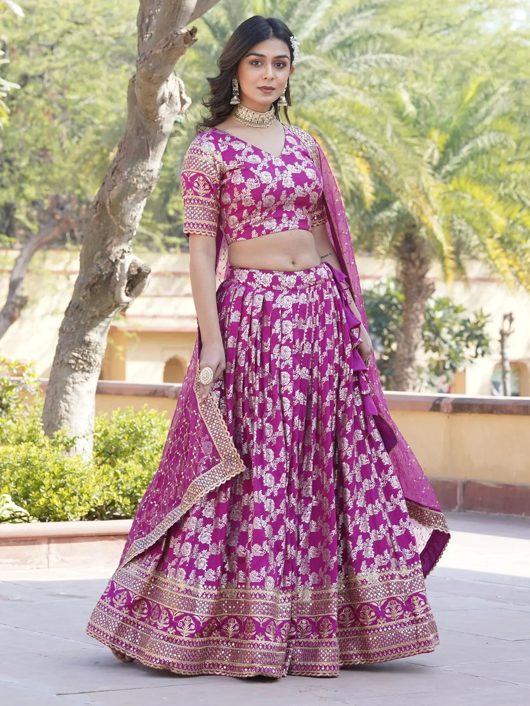 Purple floral lehenga choli with gold embroidery, perfect for Indian weddings and festive occasions