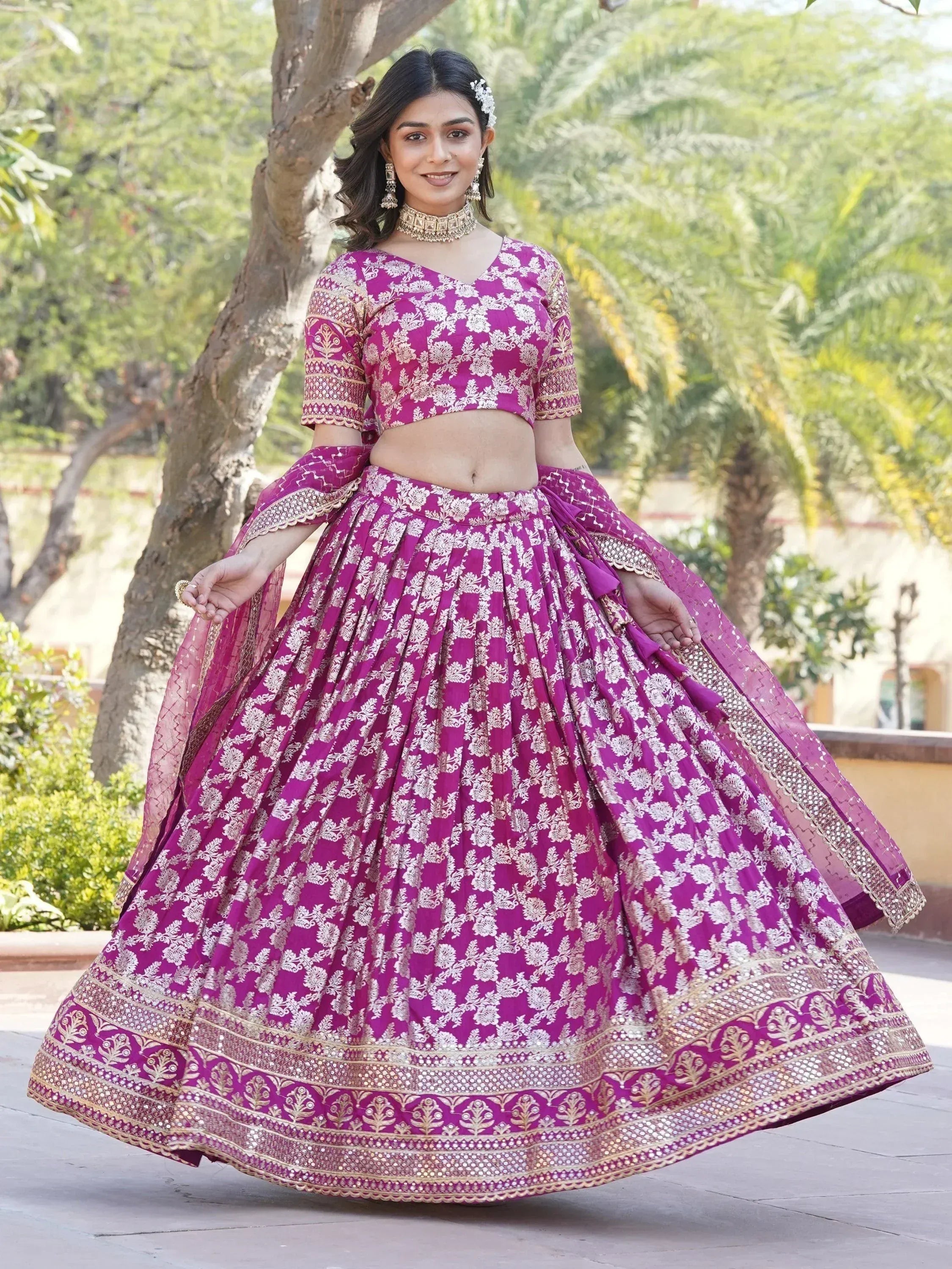 Purple floral lehenga choli with gold embroidery, perfect for Indian weddings and festive occasions.