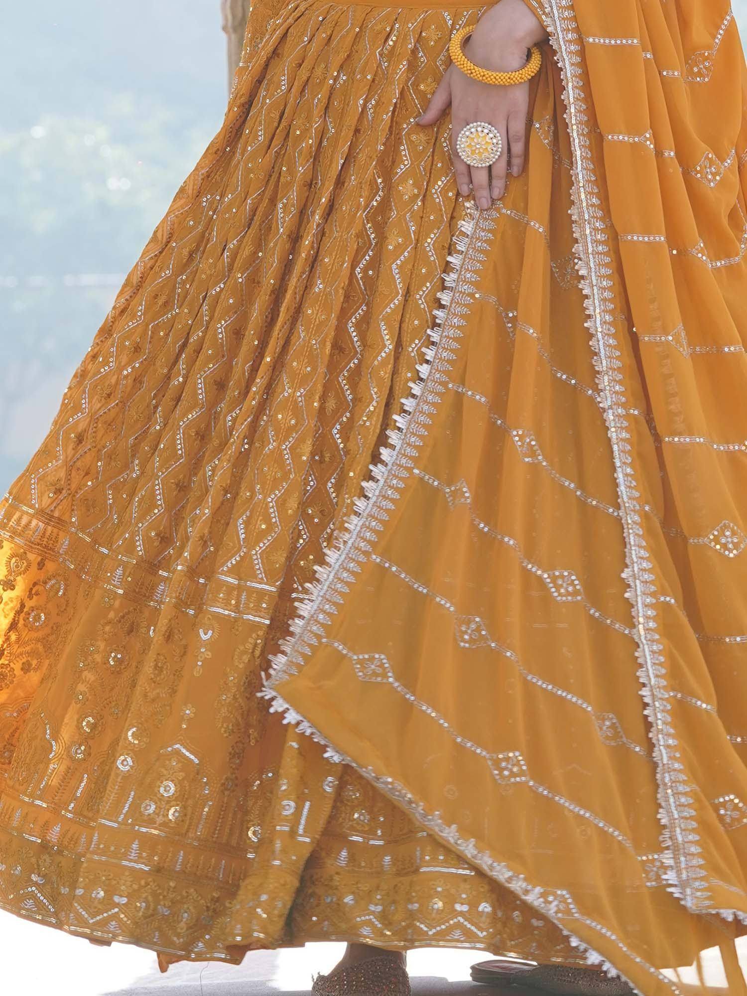 Mustard yellow lehenga choli with silver embroidery and mirror work, perfect for Indian ethnic wear