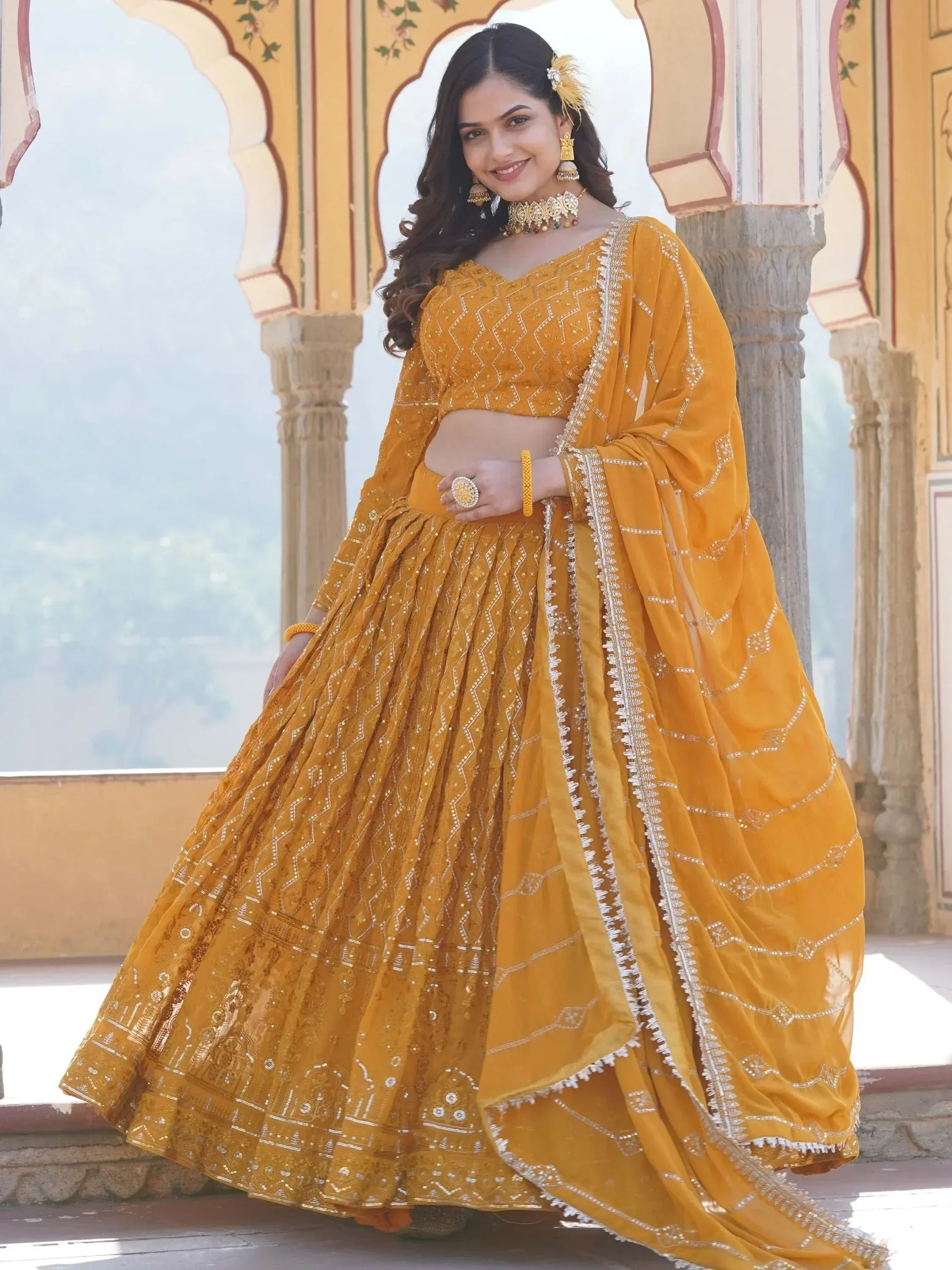 Yellow designer lehenga choli with intricate embroidery, perfect for Indian ethnic wear occasions